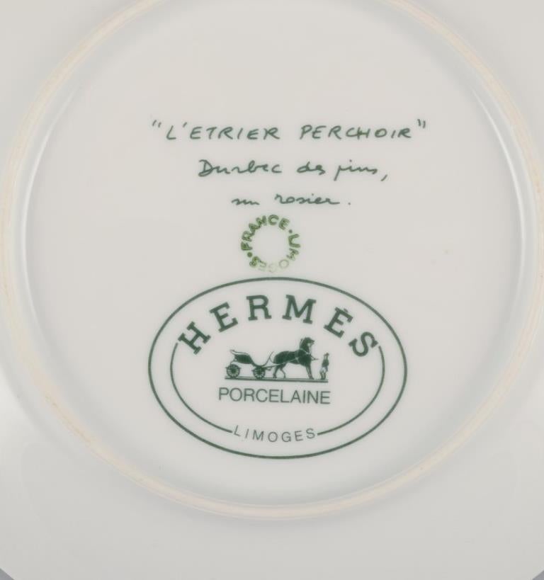 Hermès. Two porcelain plates with bird motifs. 