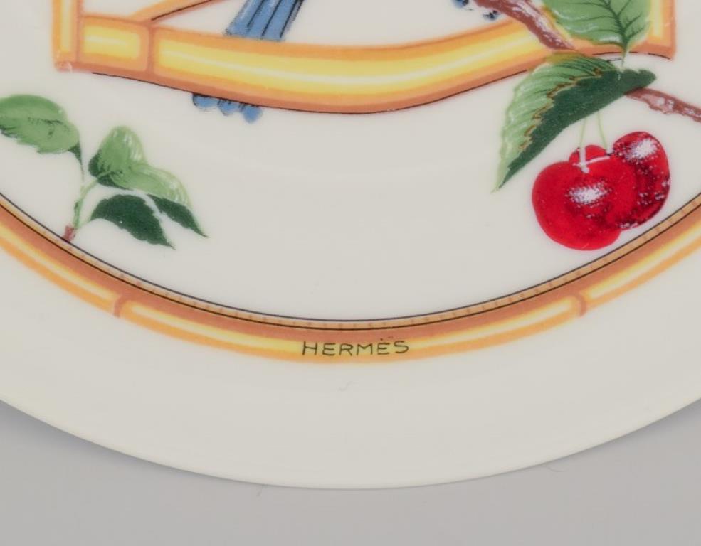 Porcelain Hermès. Two porcelain plates with bird motifs. 