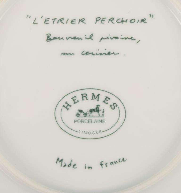 Hermès. Two porcelain plates with bird motifs. 