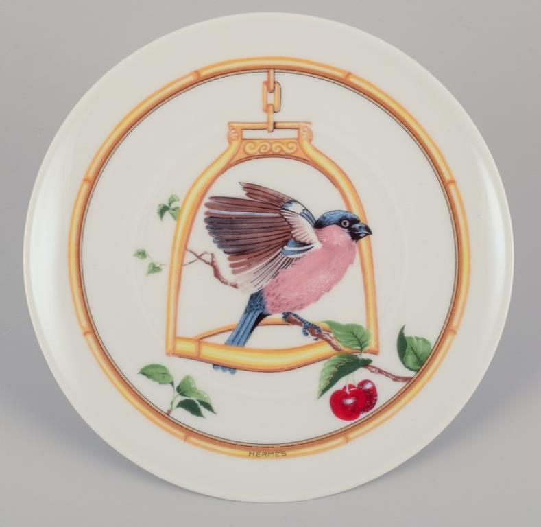 Hermès. Two porcelain plates with bird motifs. 