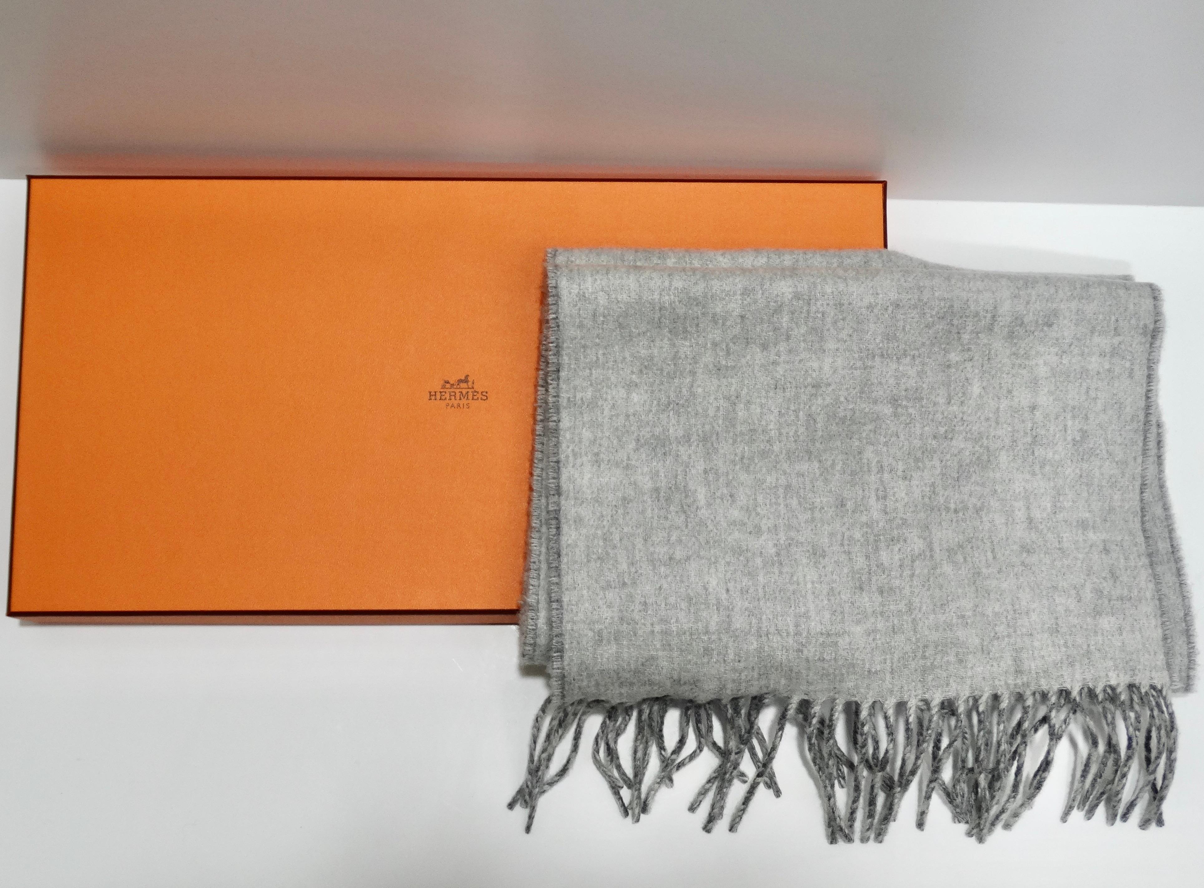 Introducing the Hermes Two Tone Grey Cashmere Scarf, a luxurious and versatile accessory that brings timeless elegance to any wardrobe. Made from the finest cashmere, this scarf offers a sumptuously soft texture that feels gentle against the skin