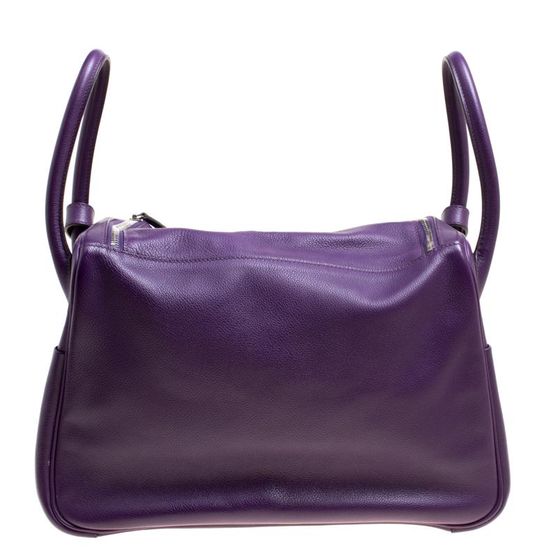 Hermes Lindy was first introduced in 2007 and has a relaxed design. An example of exemplary craftsmanship, Lindy 34 sweetly embodies ladylike elegance! Crafted from Ultraviolet Chevre de Coromandel leather, the bag has been designed to be carried by