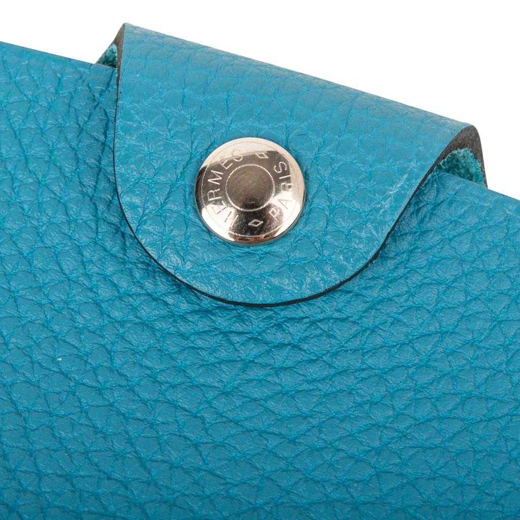 Guaranteed authentic Hermes Ulysse mini model notebook cover features Turquoise togo leather.
Palladium Clou de Selle  snap. 
Comes with a new Ulysse notebook refill.  
Each item comes with the signature Hermes box and ribbon.
New or Store Fresh