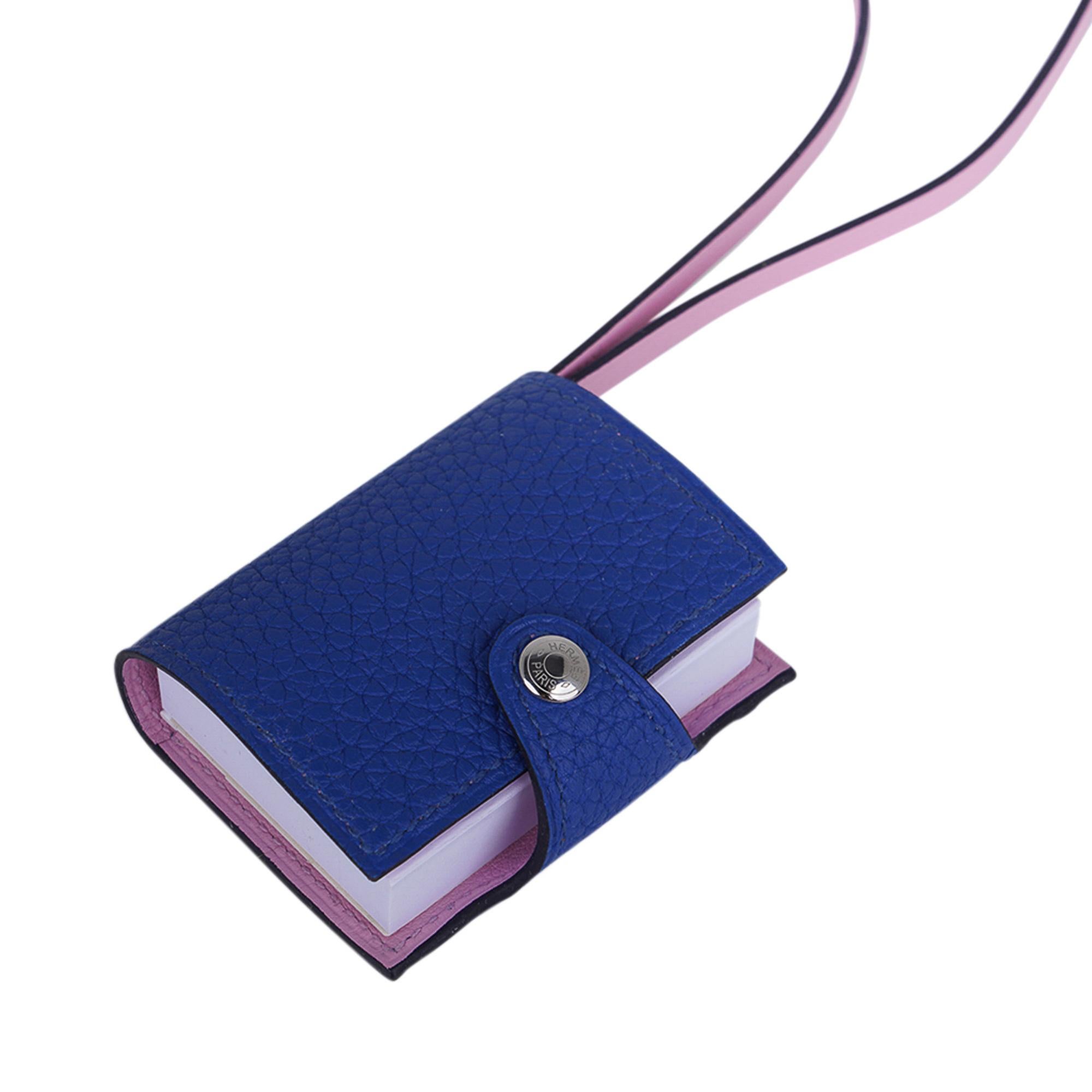 Mightychic offers an Hermes Ulysse Nano bag charm featured in Bleu de France and Mauve Sylvestre.
Bi-Color Notebook with refillable note paper.
Palladium plated hardware.
Charming and playful she easily adorns a myriad bag colours in your fabulous