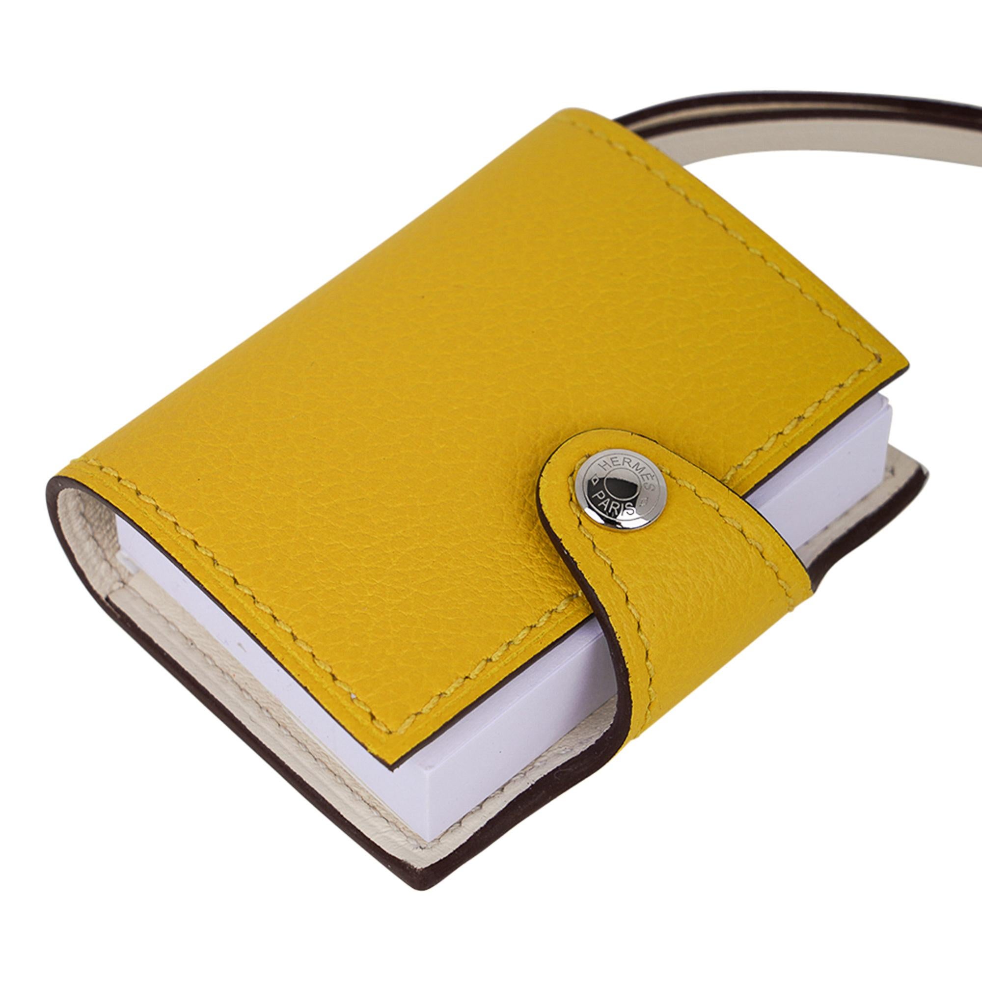 Mightychic offers a rare Hermes Ulysse Nano bag charm featured in Jaune de Naples / Nata.
Bi-Color Notebook with refillable note paper.
Palladium plated hardware.
Charming and playful she easily adorns a myriad bag colours in your fabulous