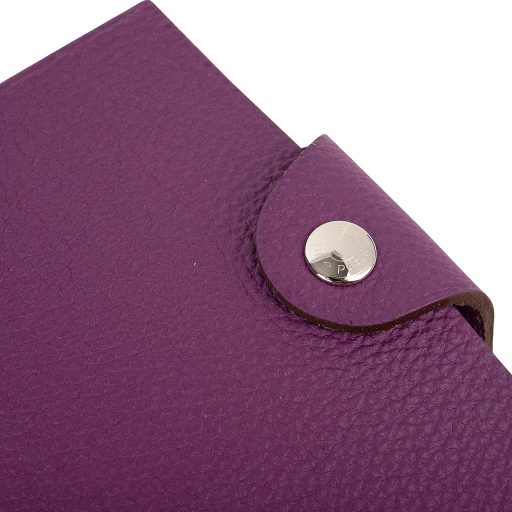 Hermes Ulysse small model notebook cover features Anemone Togo leather.
Palladium Clou de Selle  snap. 
Comes with the signature Hermes box and ribbon.
New or Store Fresh Condition.
final sale

AGENDA MEASURES:
LENGTH  4.1