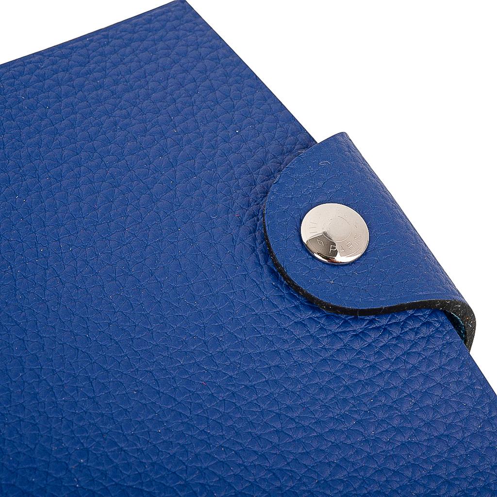 Hermes Ulysse small model notebook cover features Blue Electric Togo leather.
Palladium Clou de Selle  snap. 
Comes with the signature Hermes box and ribbon.
New or Store Fresh Condition
final sale

AGENDA MEASURES:
LENGTH  4.1