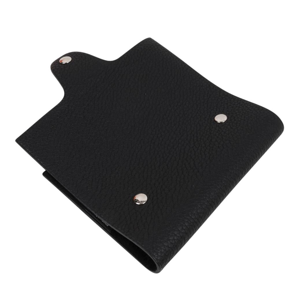 Mightychic offers an Hermes Ulysse PM model notebook cover features Black Togo leather.
Palladium Clou de Selle  snap. 
Comes with a new Ulysse notebook refill.   
Each item comes with the signature Hermes box and ribbon.
New or Store Fresh