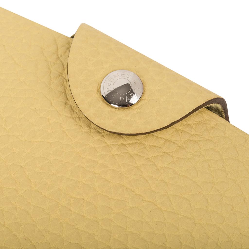 Guaranteed authentic Hermes Ulysse PM model notebook cover features Jaune Poussin togo leather.
Palladium Clou de Selle  snap. 
Comes with a new notebook lined refill.
Each item comes with the signature Hermes box and ribbon.
New or Store Fresh