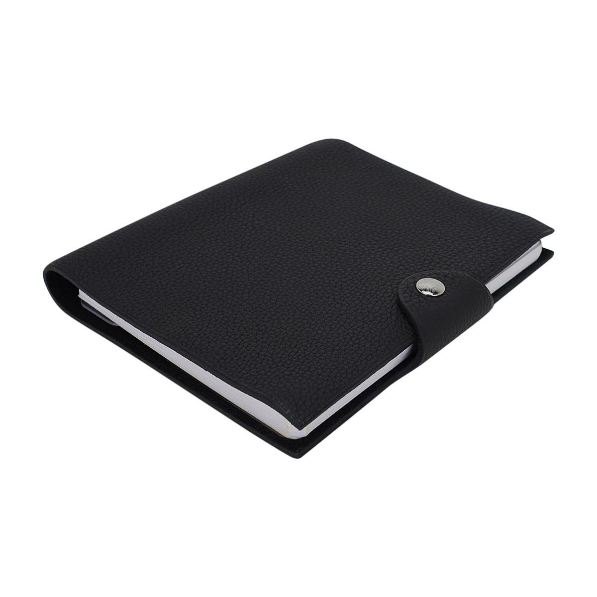 Mightychic offers an Hermes Ulysse PM model notebook cover features Black Togo leather.
Palladium Clou de Selle  snap. 
Comes with a new Ulysse notebook refill.   
New or Store Fresh Condition.
final sale

AGENDA MEASURES:
LENGTH  6.3