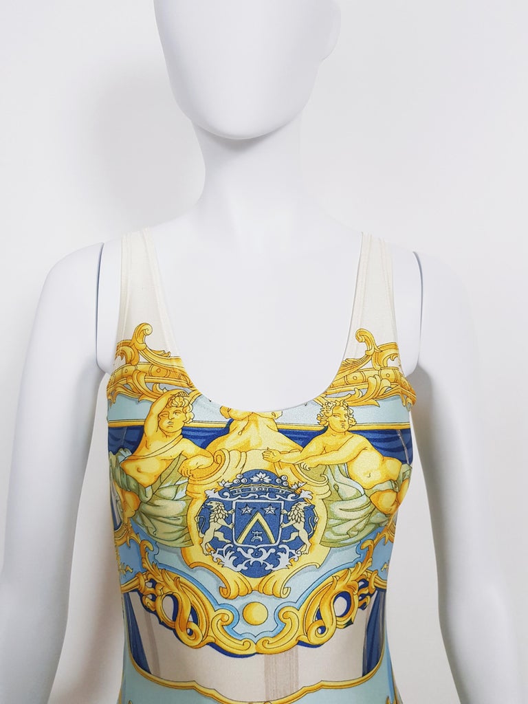 Beautiful vintage Hermès lycra sleeveless mini dress, from 90s period.
This light turquoise/yellow/cream baroque print Hermes dress is in perfect condition, and fabric is really soft and stretchy.
Made in Italy
80% Polyamid - 20% Elasthan
Can fit