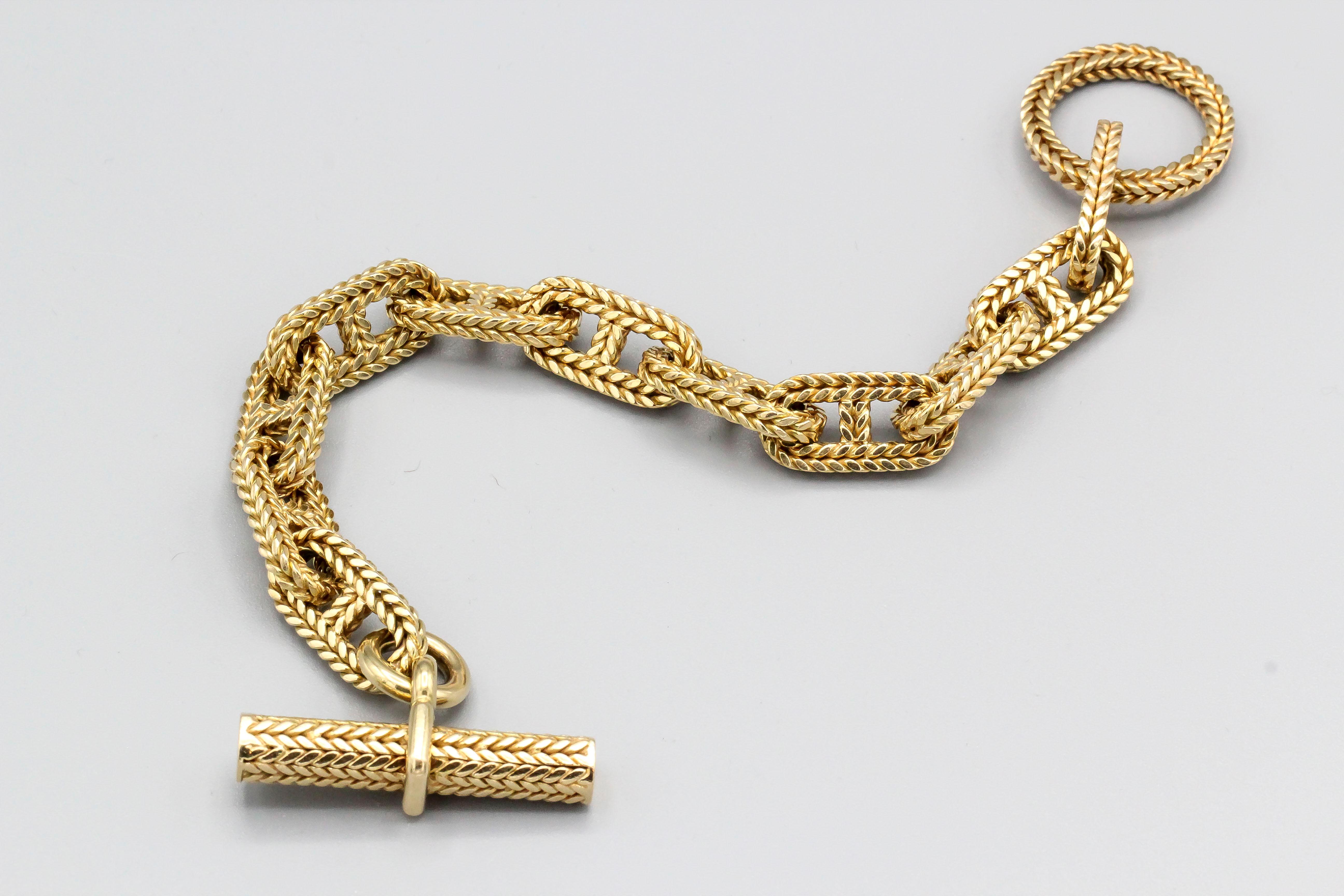 Très beau bracelet à maillons articulés en or jaune 18 carats de la collection 