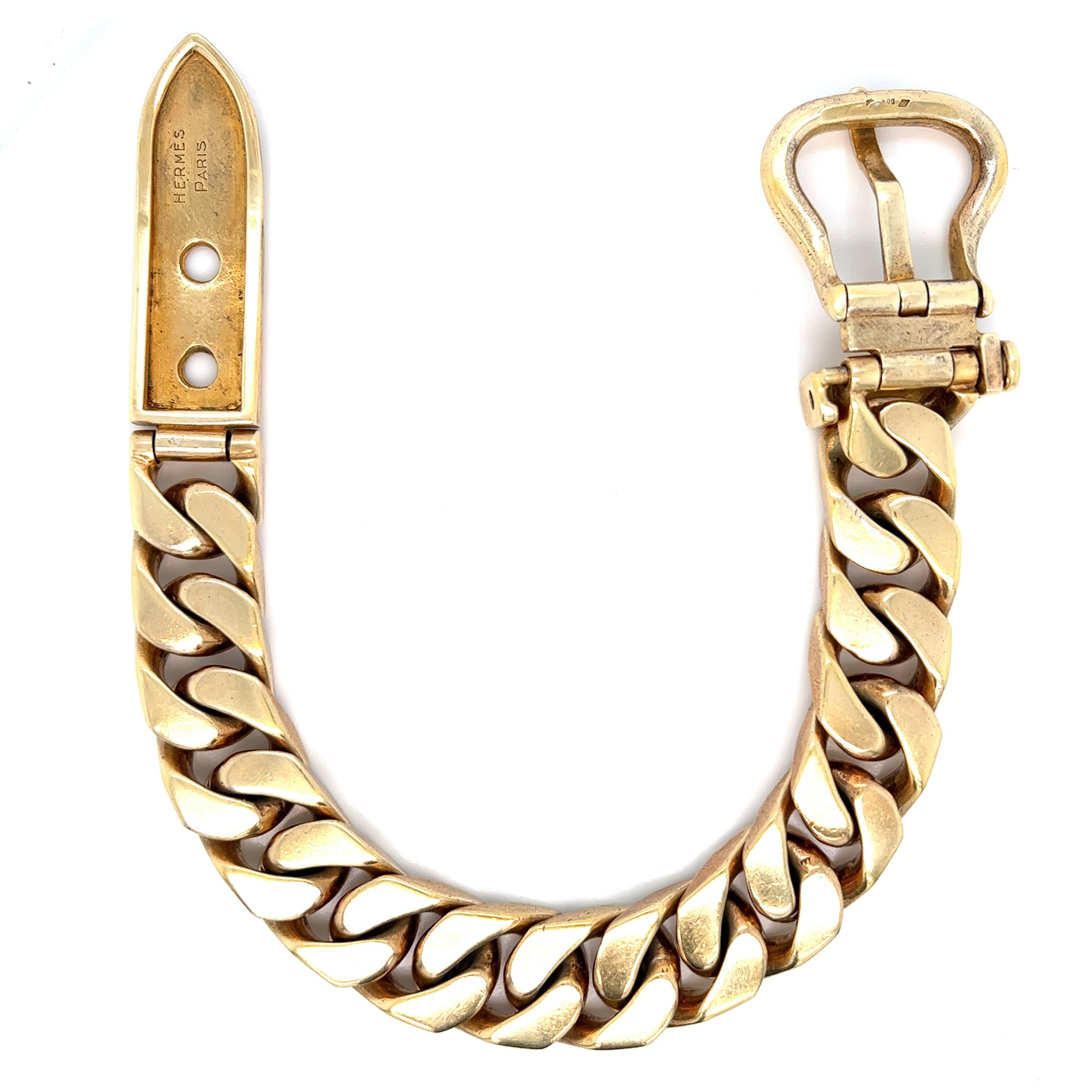 Hermés vermeil gold bracelet in the form of a belt buckle. Circa 1950s. It can fit wrist 8 inches up to 8.5 inches. Marked: Hermés / Paris. Total weight: 113.3 grams. Width: 0.5 inch. Length: 9.5 inches. 