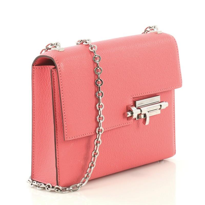 This Hermes Verrou Chaine Bag Chevre Mysore Mini, crafted from Rose Lipstick pink Chevre Mysore leather, features chain link strap, frontal flap and palladium hardware. Its slide-lock closure opens to a Rose Lipstick pink Agneau leather interior