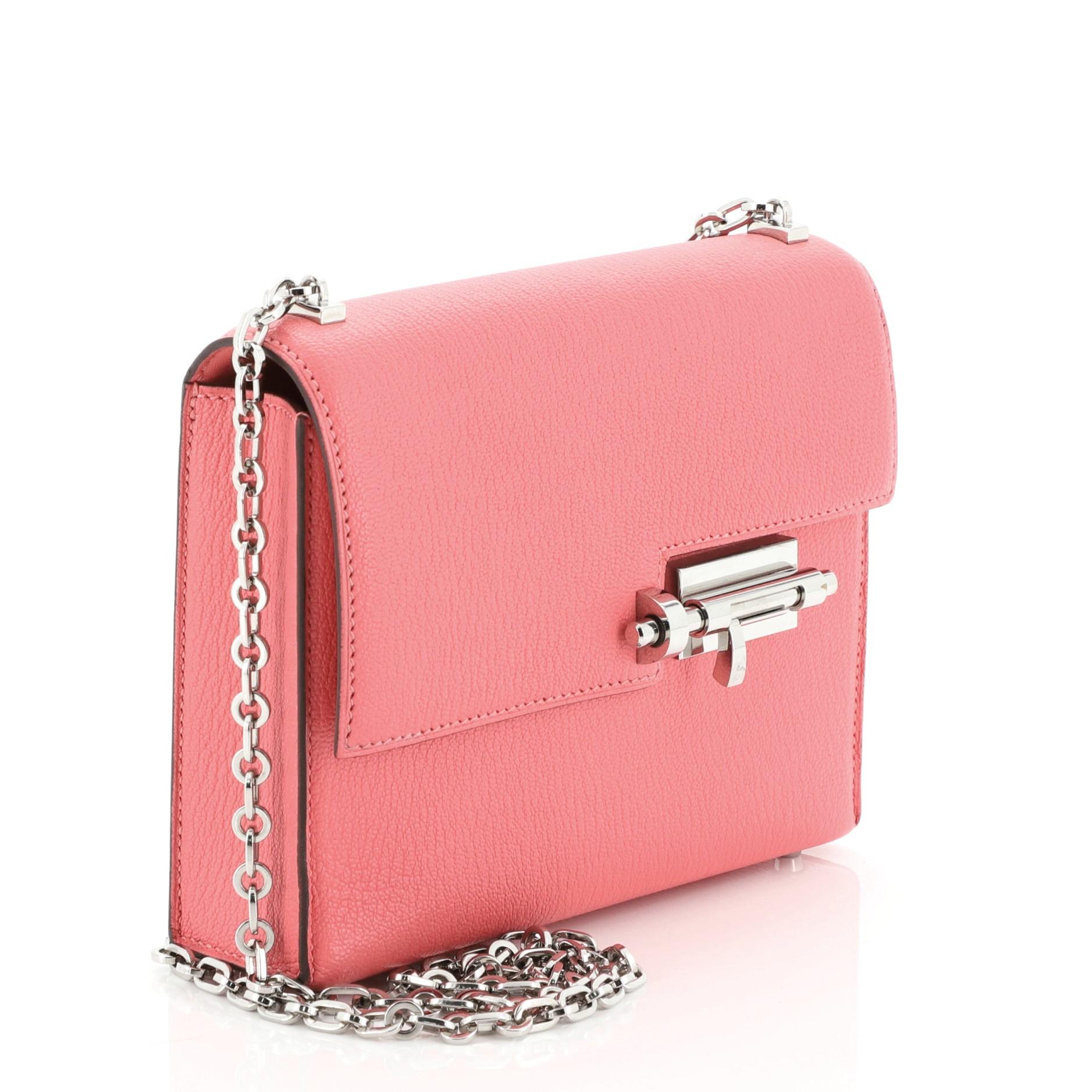 This Hermes Verrou Chaine Bag Chevre Mysore Mini, crafted from Rose Lipstick pink Chevre Mysore leather, features chain link strap, frontal flap and palladium hardware. Its slide-lock closure opens to a Rose Lipstick pink Agneau leather interior