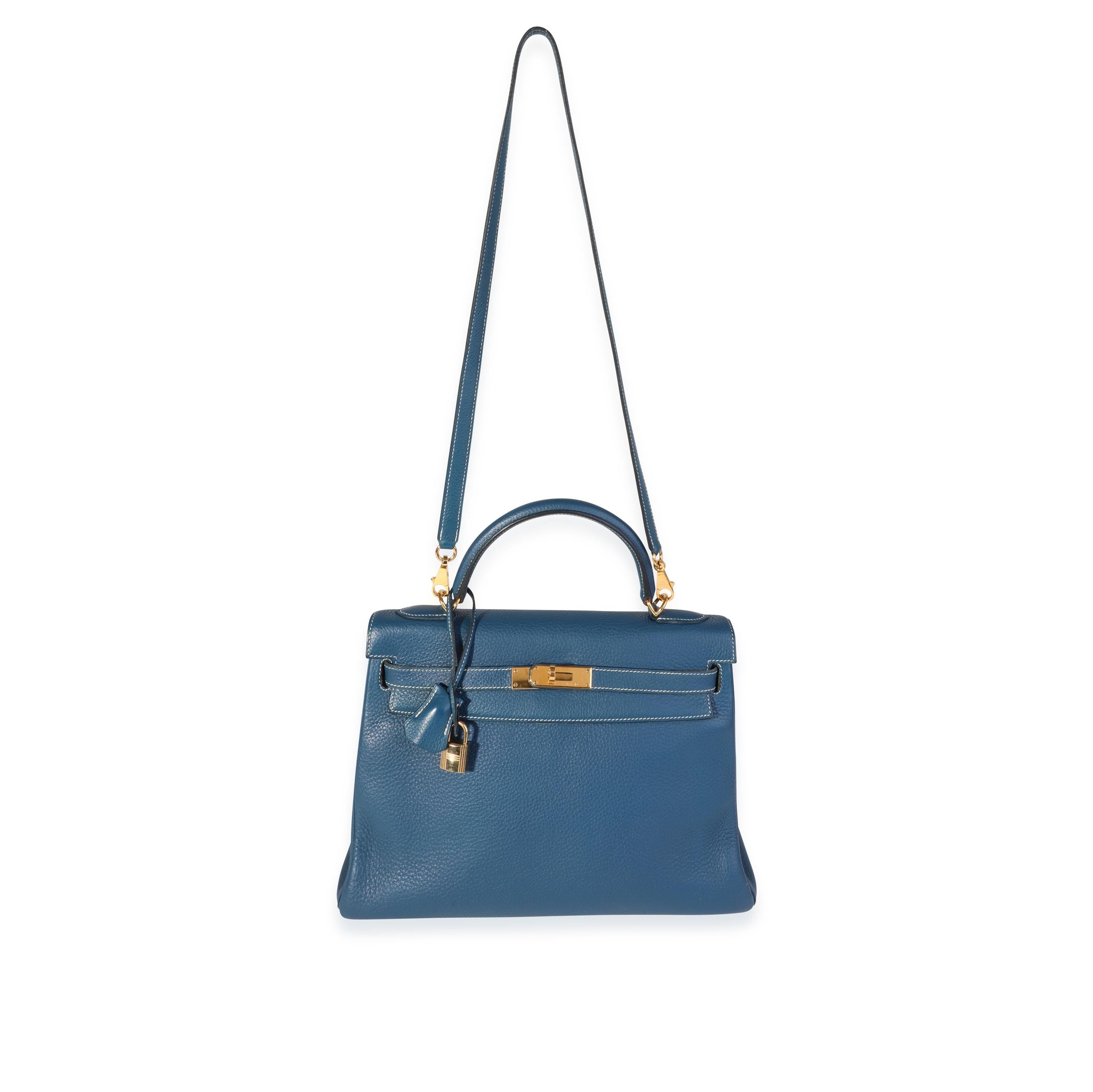 Listing Title: Hermès Verso Bleu Thalassa & Bleu Jean Clémence Retourne Kelly 32 GHW
SKU: 120034
Condition: Pre-owned (3000)
Handbag Condition: Very Good
Condition Comments: Very Good Condition. Light scuffing to corners. Scratching and tarnishing