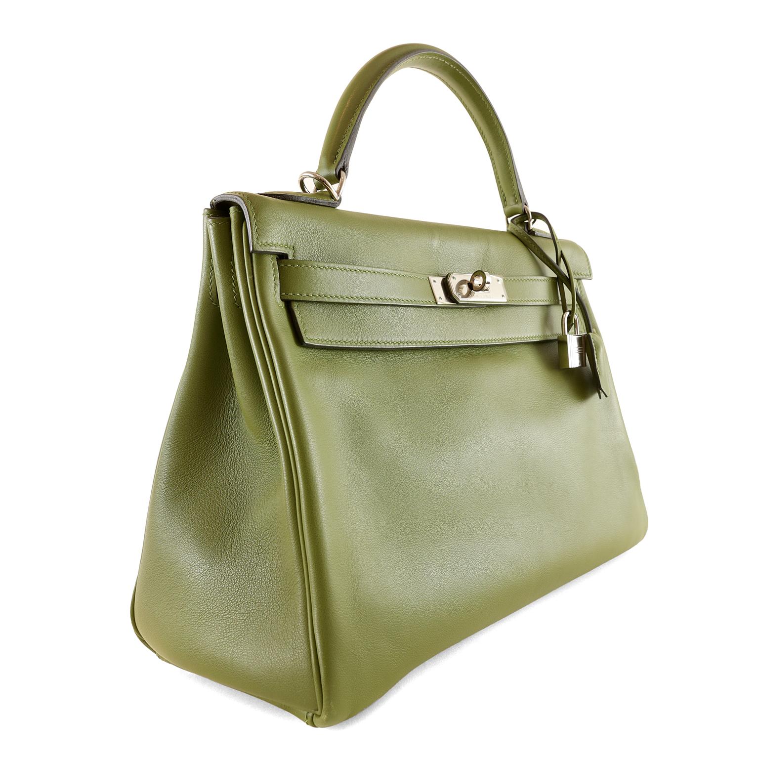 Hermès Vert Anis Swift Leather 32 cm Kelly- pristine condition with the protective plastic still intact on much of the hardware
 Hermès bags are considered the ultimate luxury item worldwide.  Each piece is handcrafted with waitlists that can exceed