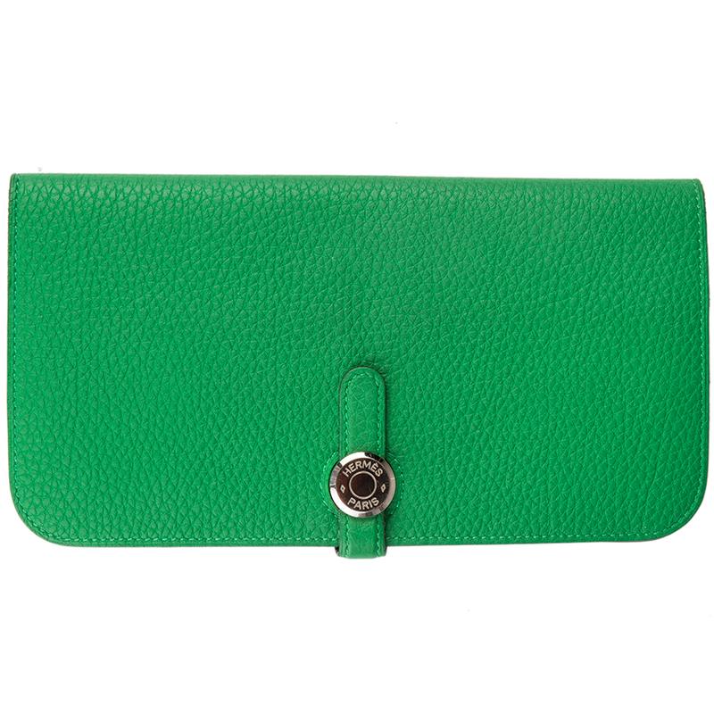 Hermes 'Dogon Recto-Verso' wallet in Bamboo Togo (grained leather) with zipper pocket on the back. Opens with loop on the front. Lined in green lambskin leather with eight credit card slots and two bigger slots for your bills. Has been carried very
