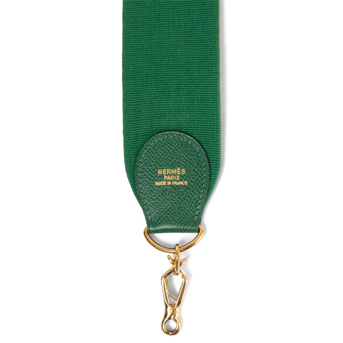 100% authentic Hermès shoulder strap for your Kelly or Evelyne bag in Vert green canvas and leather. Has been carried and is in excellent condition. 

Measurements
Width	5cm (2in)
Length	110cm (42.9in)
Hardware	Gold-Tone

All our listings include