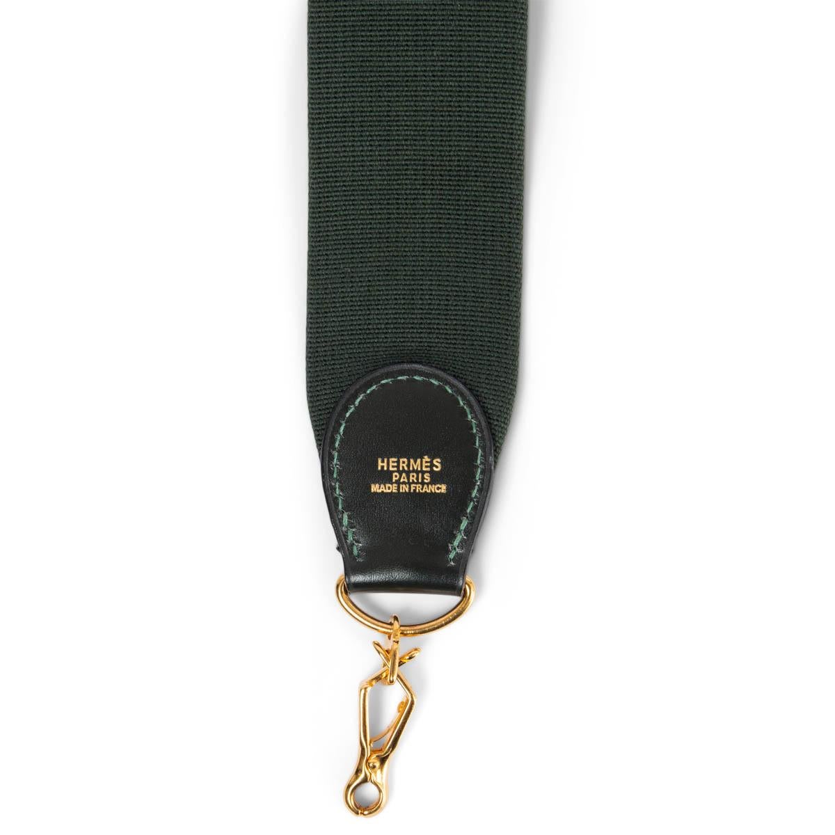100% authentic Hermès shoulder strap for your Kelly or Evelyne bag in Vert Fonce (dark green) canvas and Box leather. Has been carried with a few brown spots on the canvas. Overall in good condition. 

Measurements
Width	5cm (2in)
Length	110cm