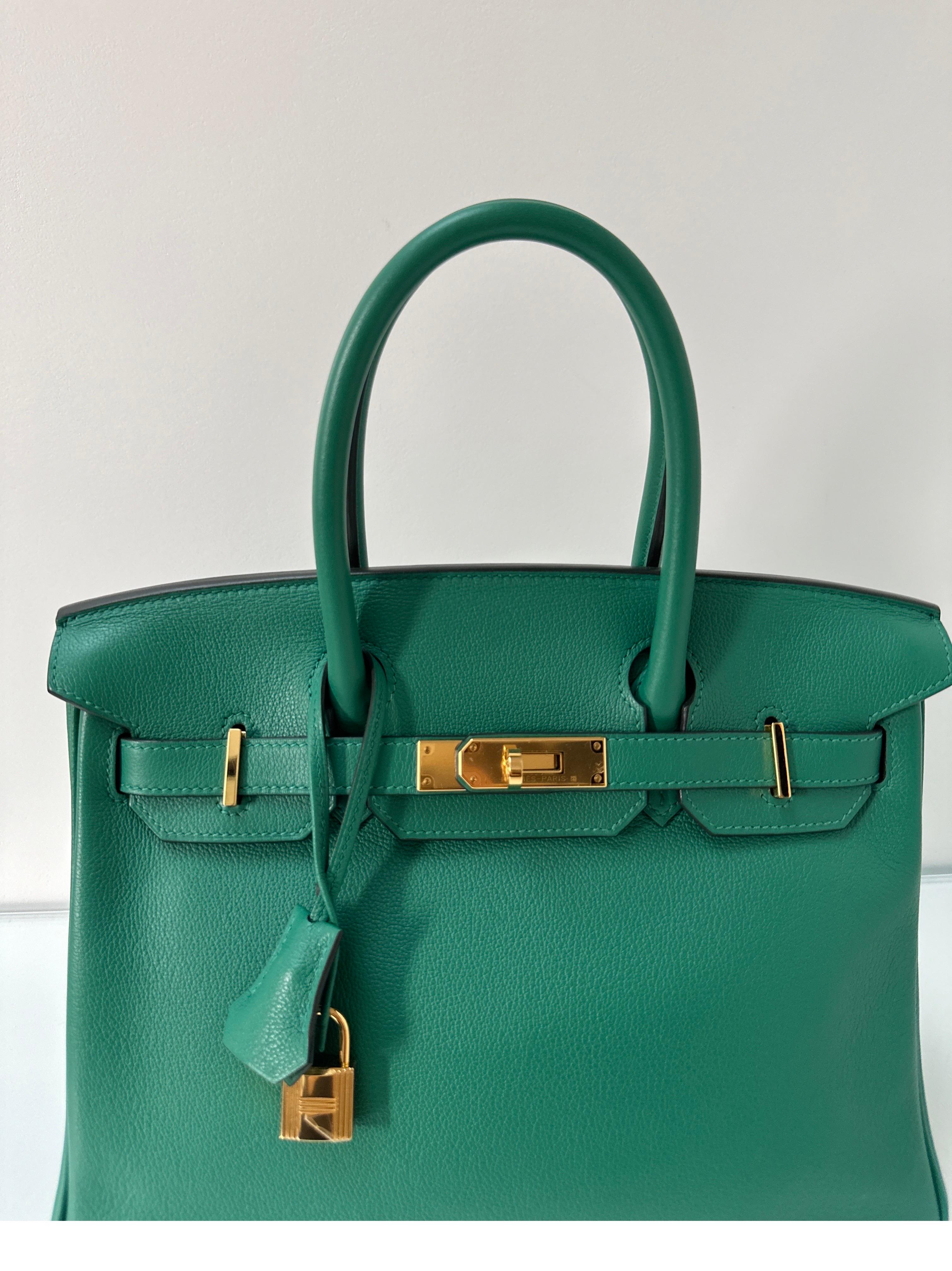 Hermes Vert Vertigo Birkin 30 Bag. Excellent condition. Looks like new condition. Plastic is still on hardware. Newer bag and hot new color. The green is neutral and has gold hardware. Most wanted smaller size 30 Birkin. Interior clean. Rare color
