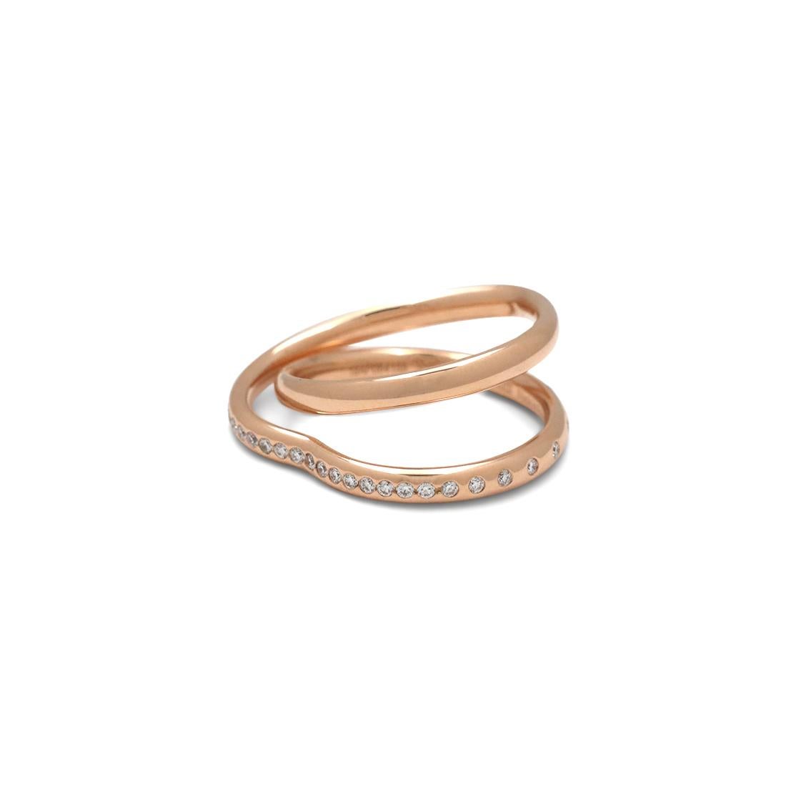 Authentic Hermes Vertige Coeur ring crafted in 18 karat rose gold and designed in the shape of a double ring. The second ring is heart-shaped and is set with round brilliant cut diamonds with an estimated total carat weight of 0.21. Signed Hermes,