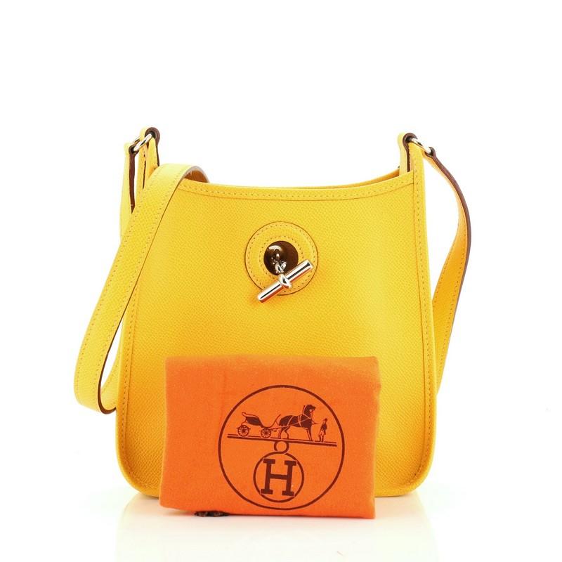 This Hermes Vespa Handbag Epsom TPM, crafted in Soleil yellow Epsom leather, features a flat leather strap and palladium hardware. Its Chaine d'Ancre closure opens to a Soleil yellow leather and suede interior. Date stamp reads: G Square (2003).