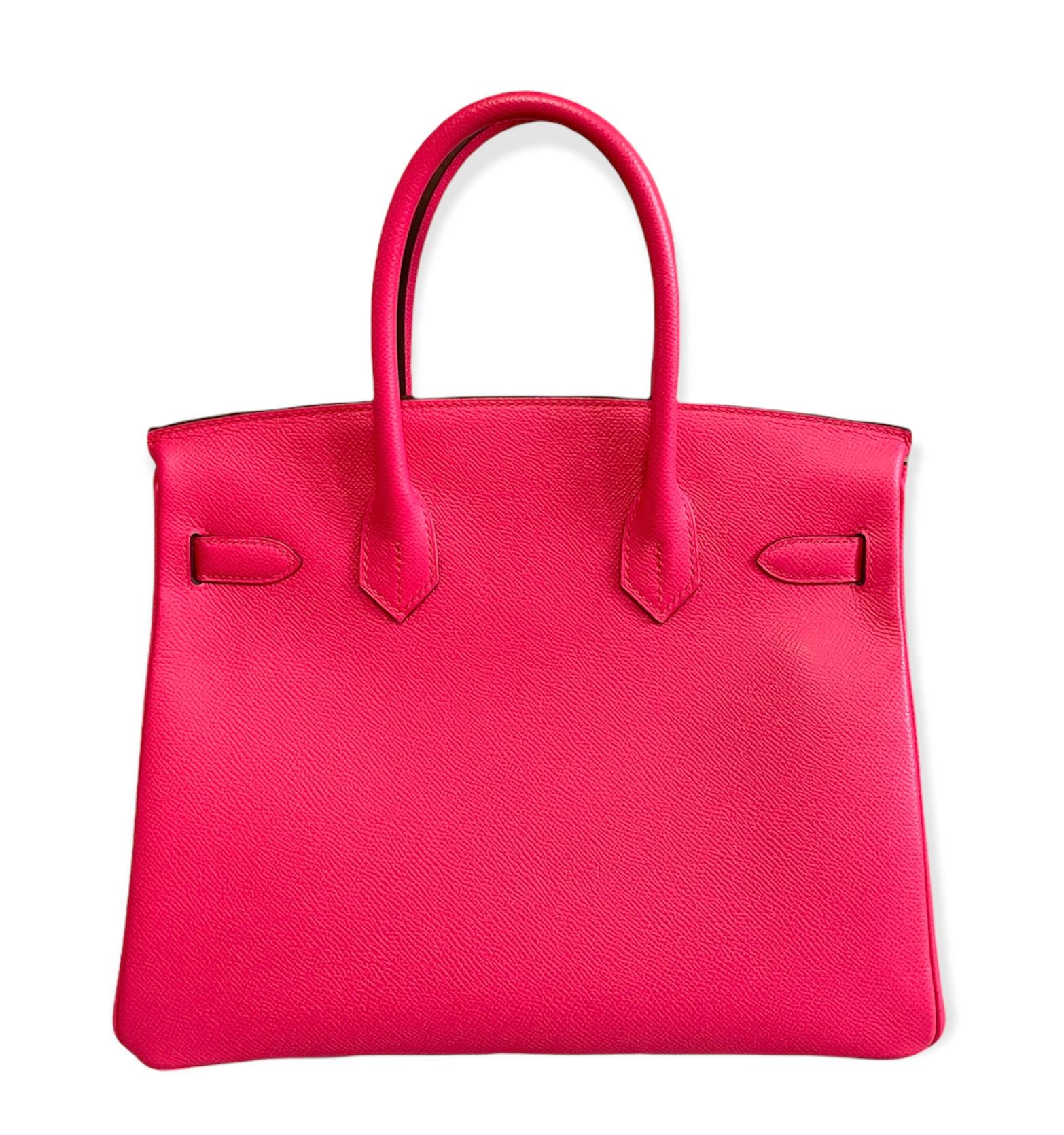 This authentic Hermès Vibrant Rose Epsom 30 cm Birkin is in pristine unworn condition; the protective plastic is still intact on the hardware.    Considered the ultimate luxury item, the Hermès Birkin is stitched by hand. Waitlists are commonplace