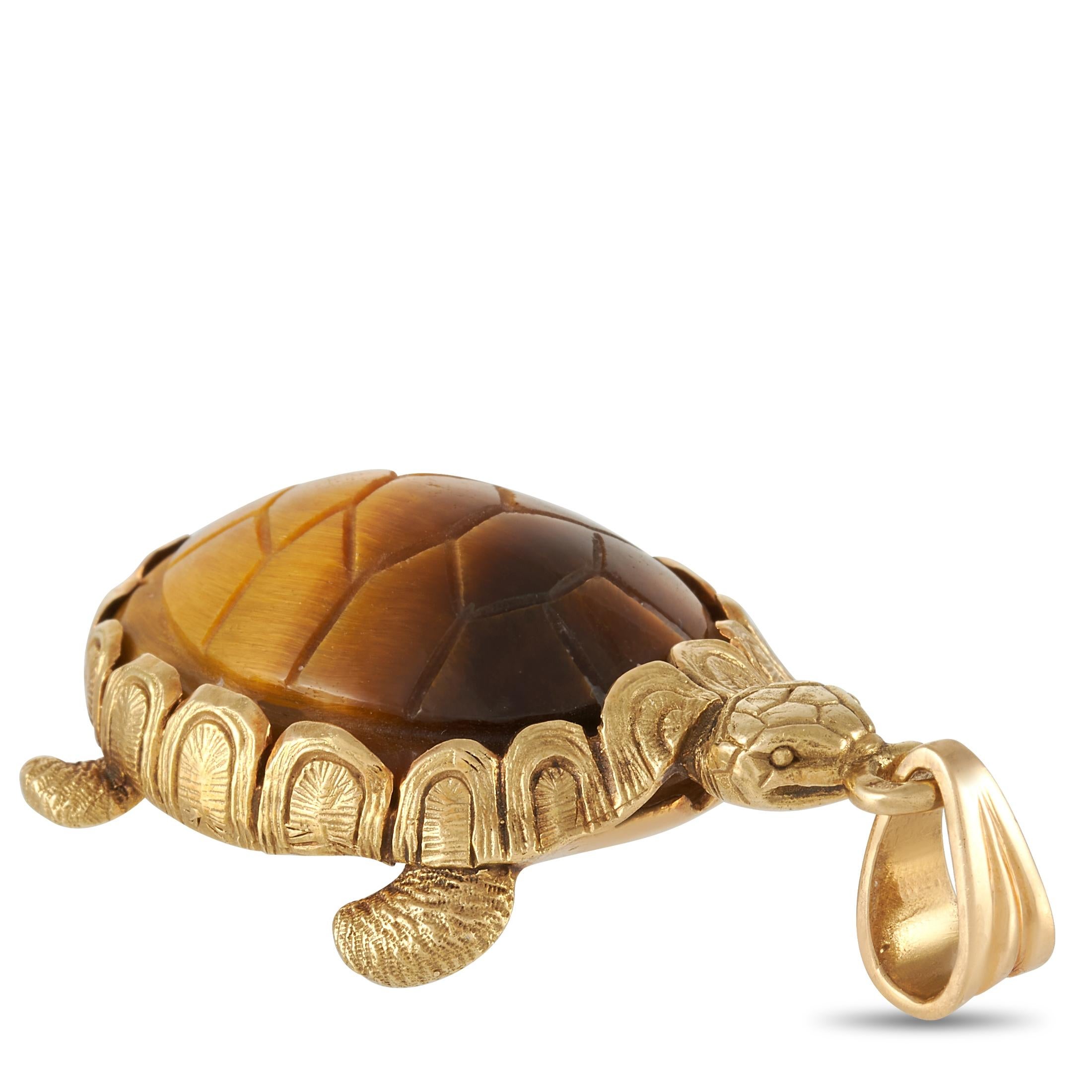 This cool vintage 18K Yellow Gold Hermes Tiger's Eye Turtle Pendant by Hermès is elegant and fun. The turtle pendant is beautifully crafted and detailed out of 18K yellow gold with a carved tigers eye shell. The pendant measures 2 inches in length
