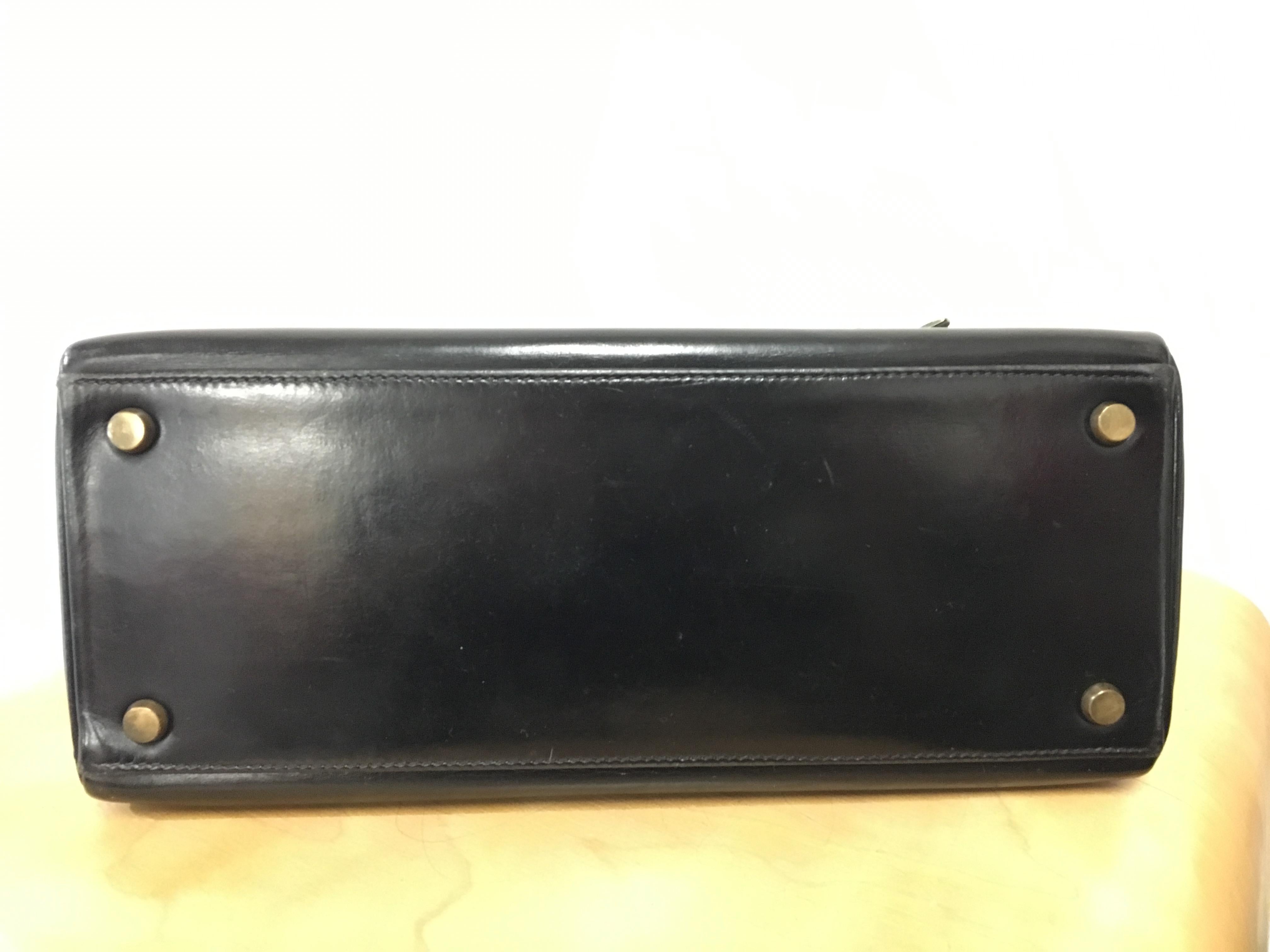 Black Hermès vintage 1950's black leather Kelly bag. For Sale
