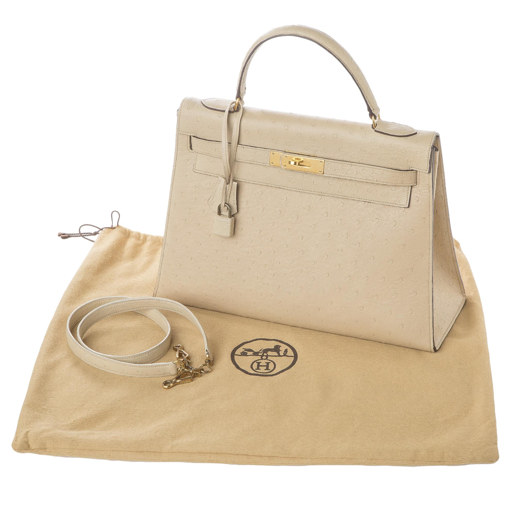 Exquisite vintage Hermés Kelly handbag in tan ostrich with detachable shoulder strap, original Hermés dust bag and gold tone hardware, lock, clochette and key.  

This is not your typical Hermes bag, this fine vintage example is something special