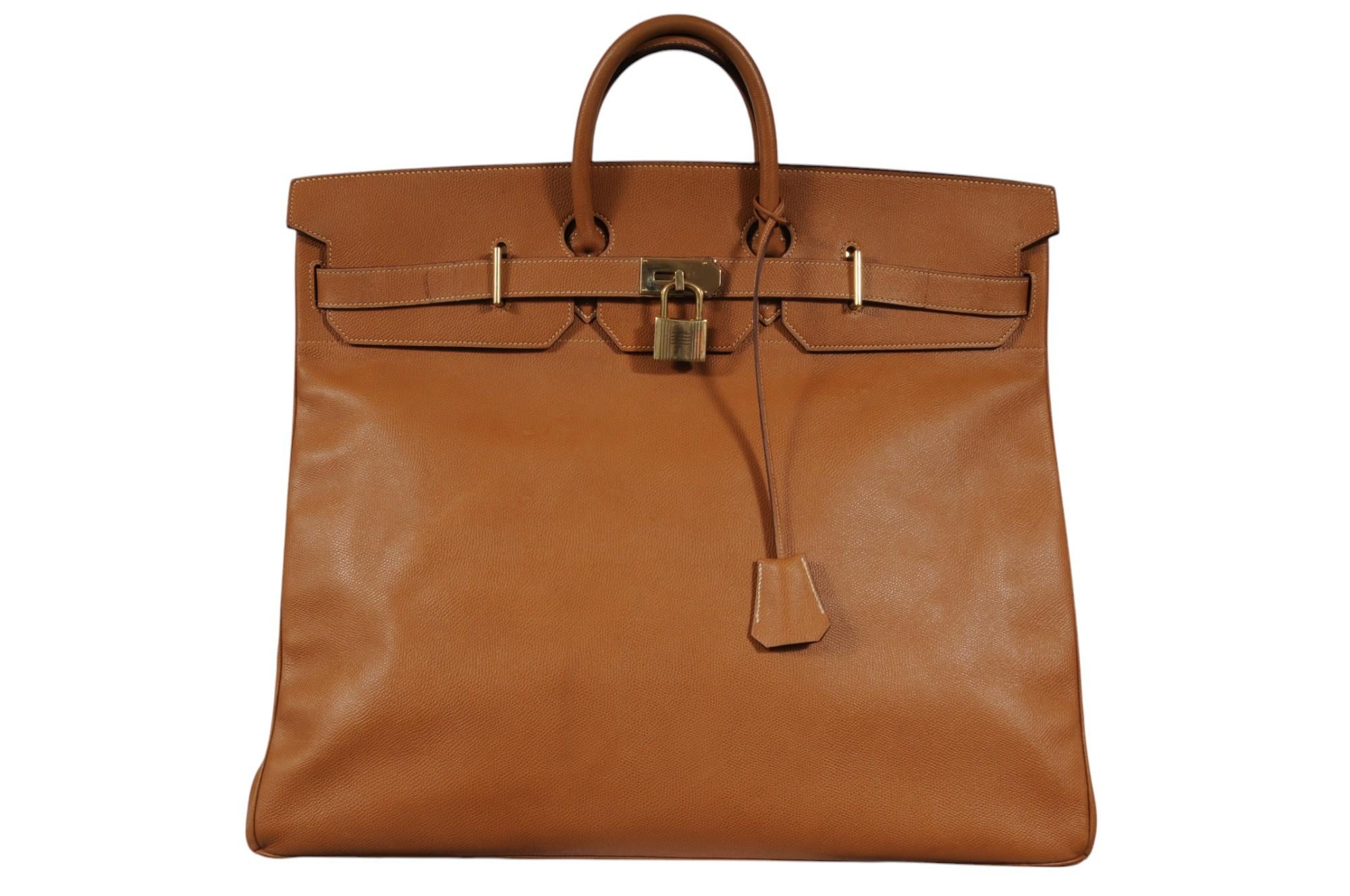 - Steamped Circle P ( 1986 )
-  Brass Hardware 
- Comes With Lock & Key
- Natural Tan Leather Exterior 
- Discontinued 55 Size 
- The bag holds it shape when empty 

Condition: 

The bag is in exceptional condition for its age, the leather exterior