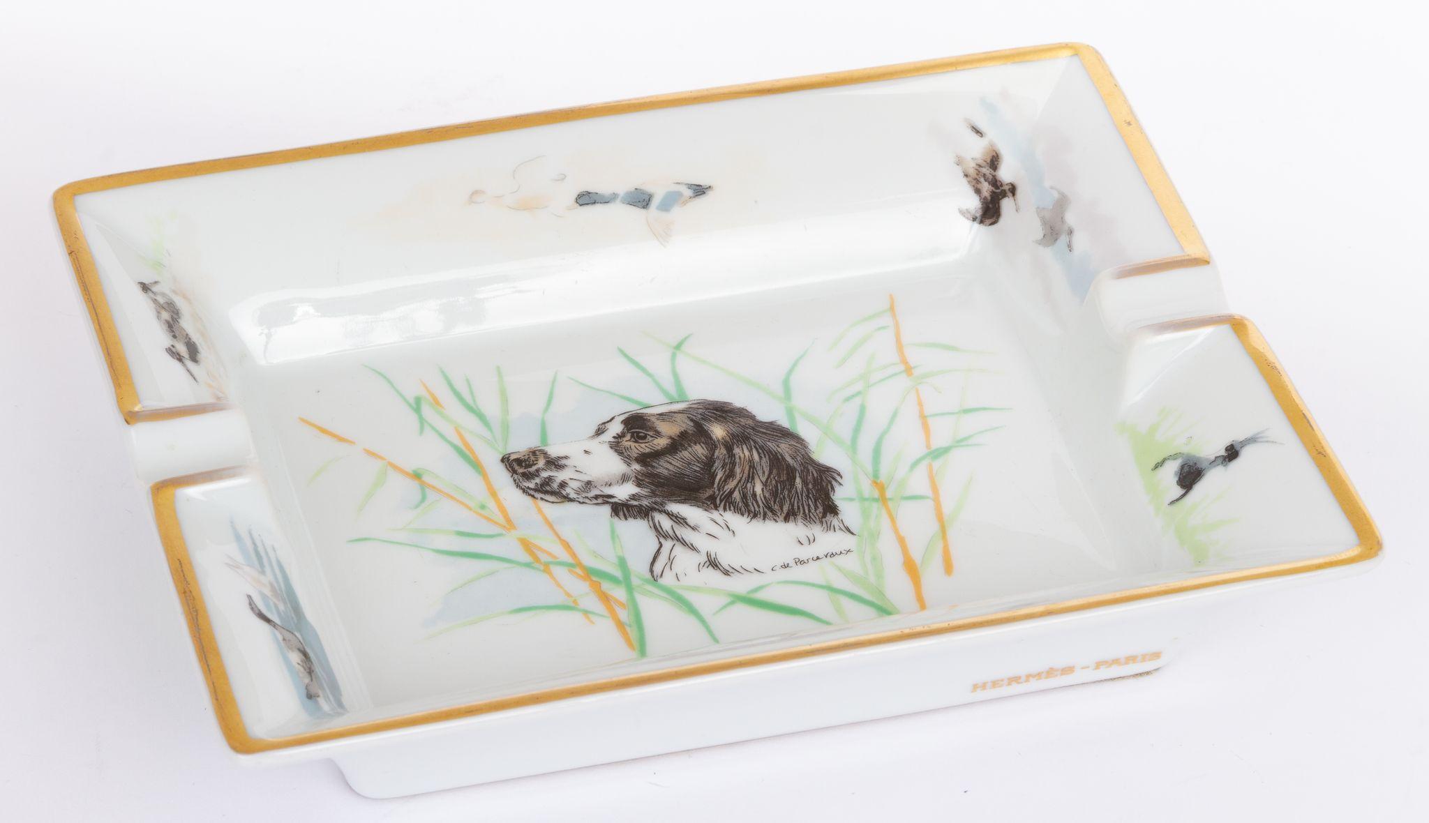 Hermès vintage ashtray with the image of a head of an English Setter in the center. On the outside the piece is framed with gold. The ashtray is in excellent condition and comes with the original box.