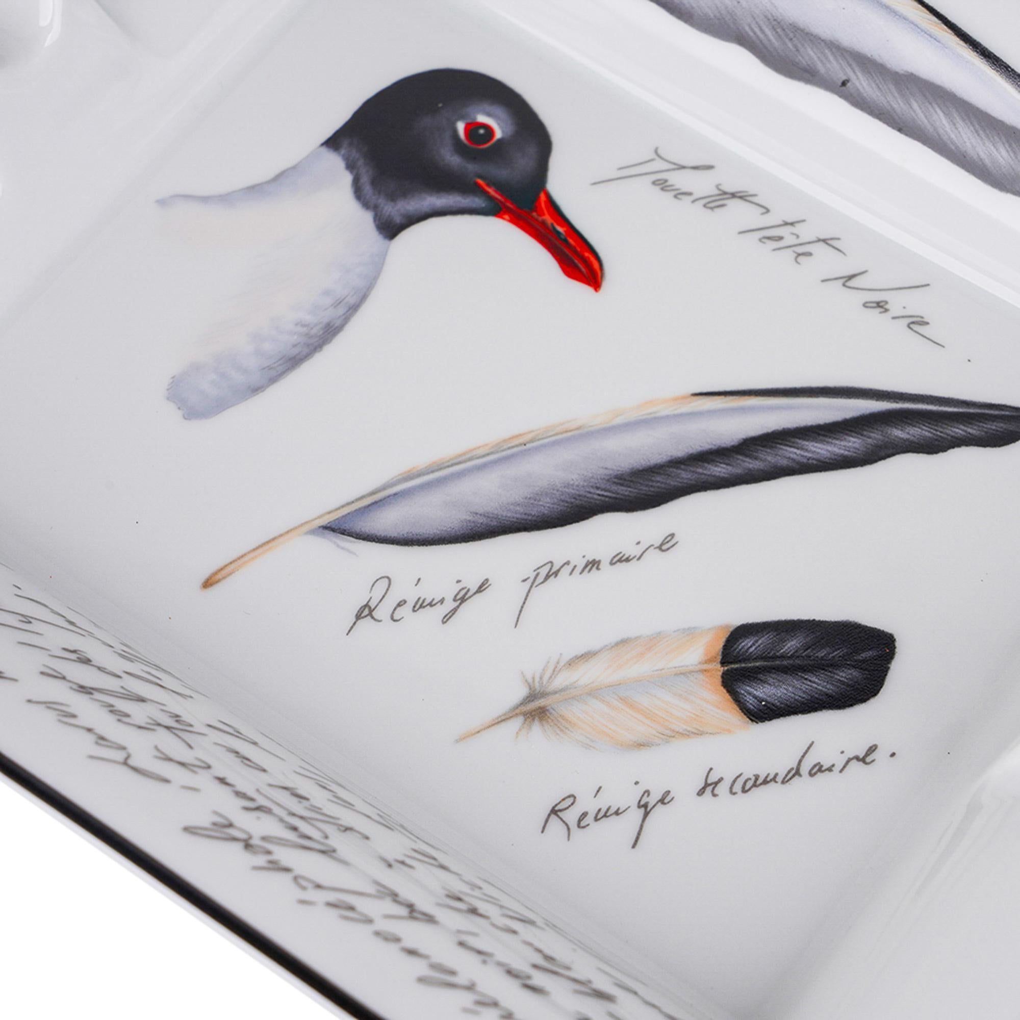 Mightychic offers a  very rare vintage Hermes Mouette Avec Tete Noir (Black Headed Gull) ashtray.
Hand-painted Limoges Porcelain in Grey, Black and White.
Charcoal trim.
A decorative ashtray or tray piece perfect for any room.
Protected by velvet