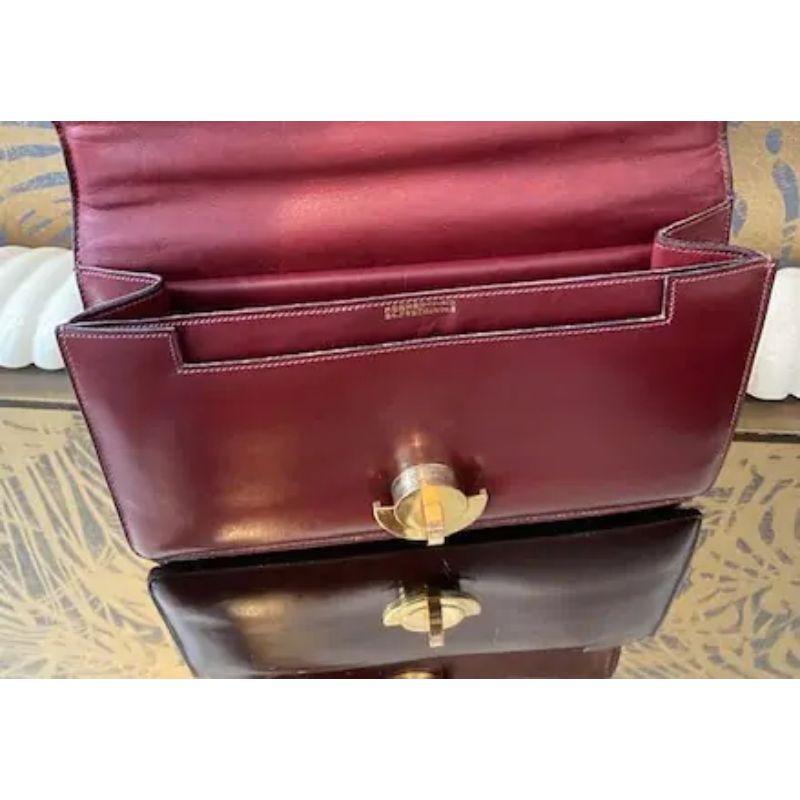 Love love love the clasp of this model !!! and so rare to find an Hermès bag with the signature 24, Fg St Honoré. Circa 1950. Exceptional design and quality of box leather. The model is called the Demi-lune. Made of burgundy calf leather and gold