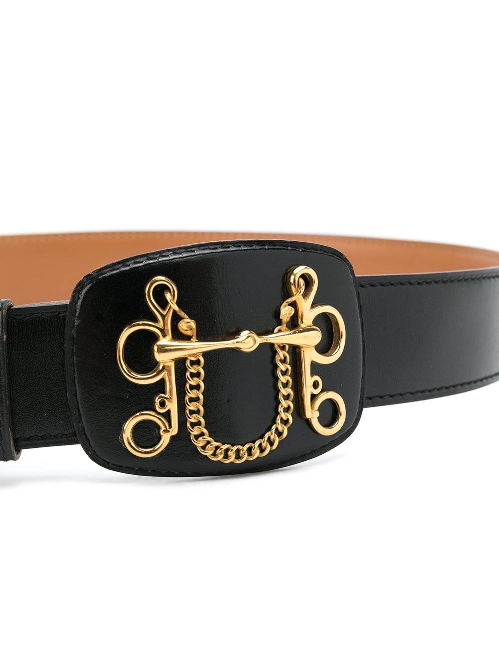 Black leather belt from Hermès Vintage featuring a clip fastening, gold-tone hardware and a narrow construction.

Material: Leather

One Size

Condition: Pre-owned, very good condition.
Light usage, with minor signs of wear-and-tear.

Returns
