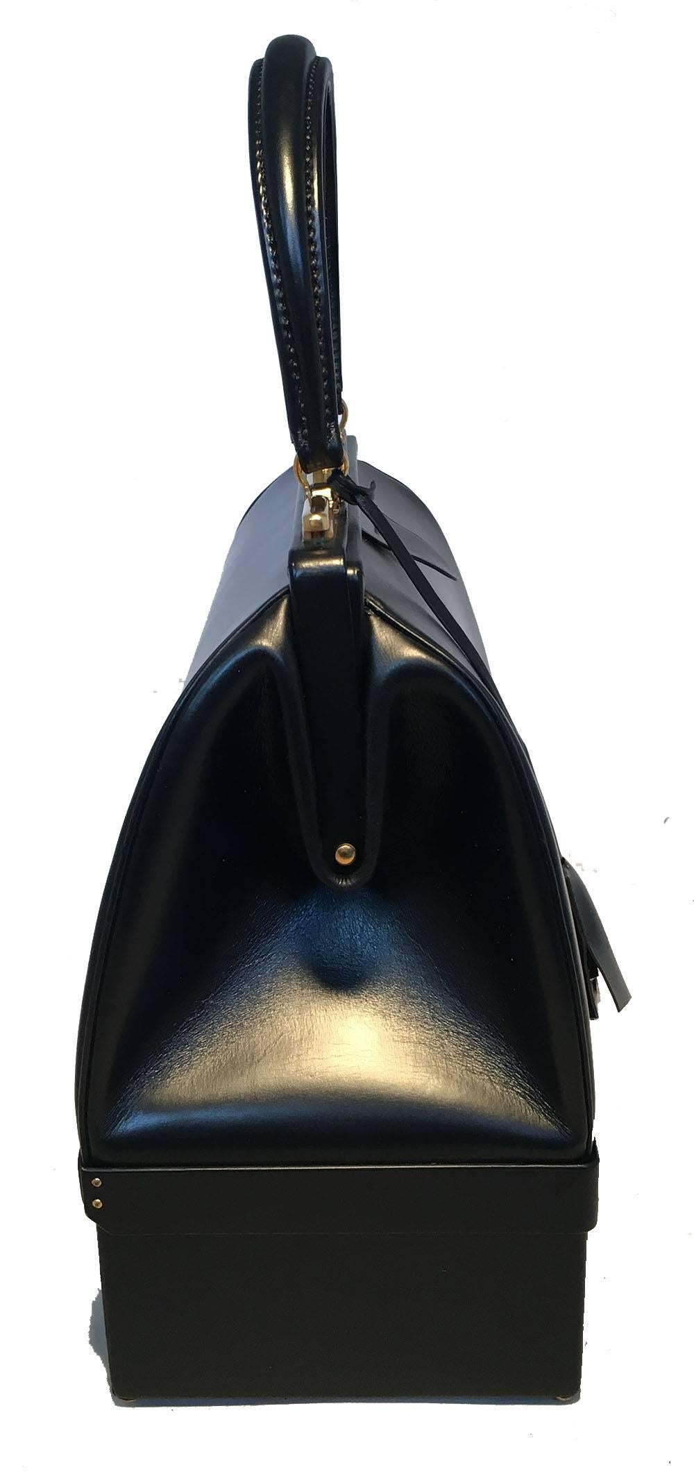 GORGEOUS Hermes Vintage Black Box Calf Sac Mallette Handbag in very good vintage condition. Black box calf leather exterior trimmed with gold hardware and matching leather clochette with original keys. Top button and sliding latch closure opens to a