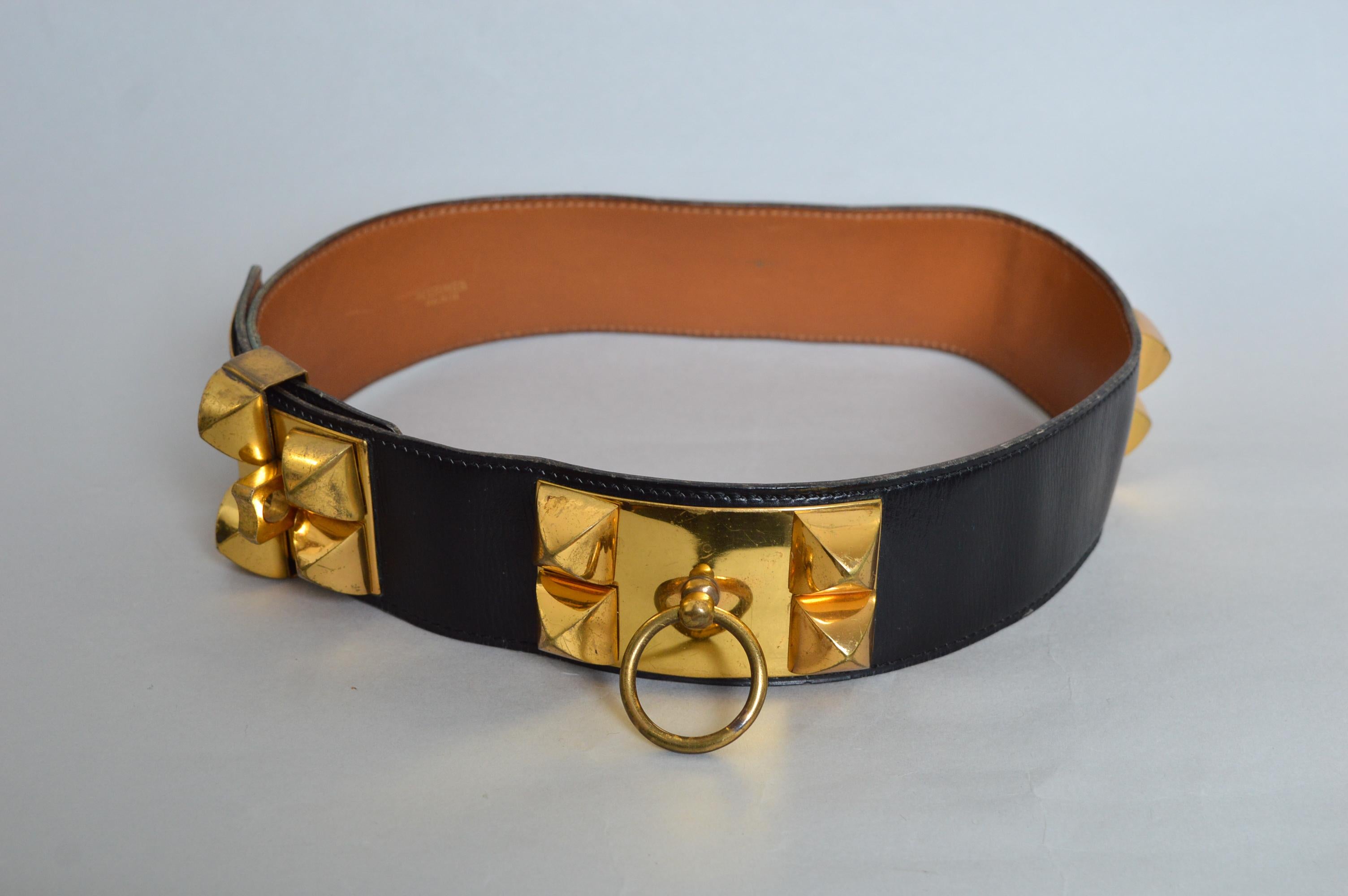 Superb Vintage Hermès Black leather ‘Collier de chien’ waist belt with decorative Gold square details on the front and tan leather lined interior. The belt is Stamped in gold lettering ‘HERMÈS PARIS’ as well as various stamps to the metal work.