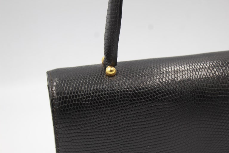 Vintage Hermes black lizard  bag in good vintage condition (leather shiny and interior too)
Size 26x16 cm
Signed inside 
Clasp also signed, some signs of wear 