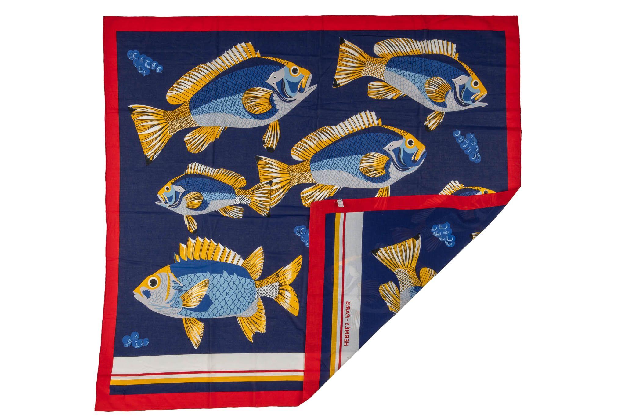 Hermès vintage blue and red fish cotton sarong. Few stains and a mended hole.
Composition label only.