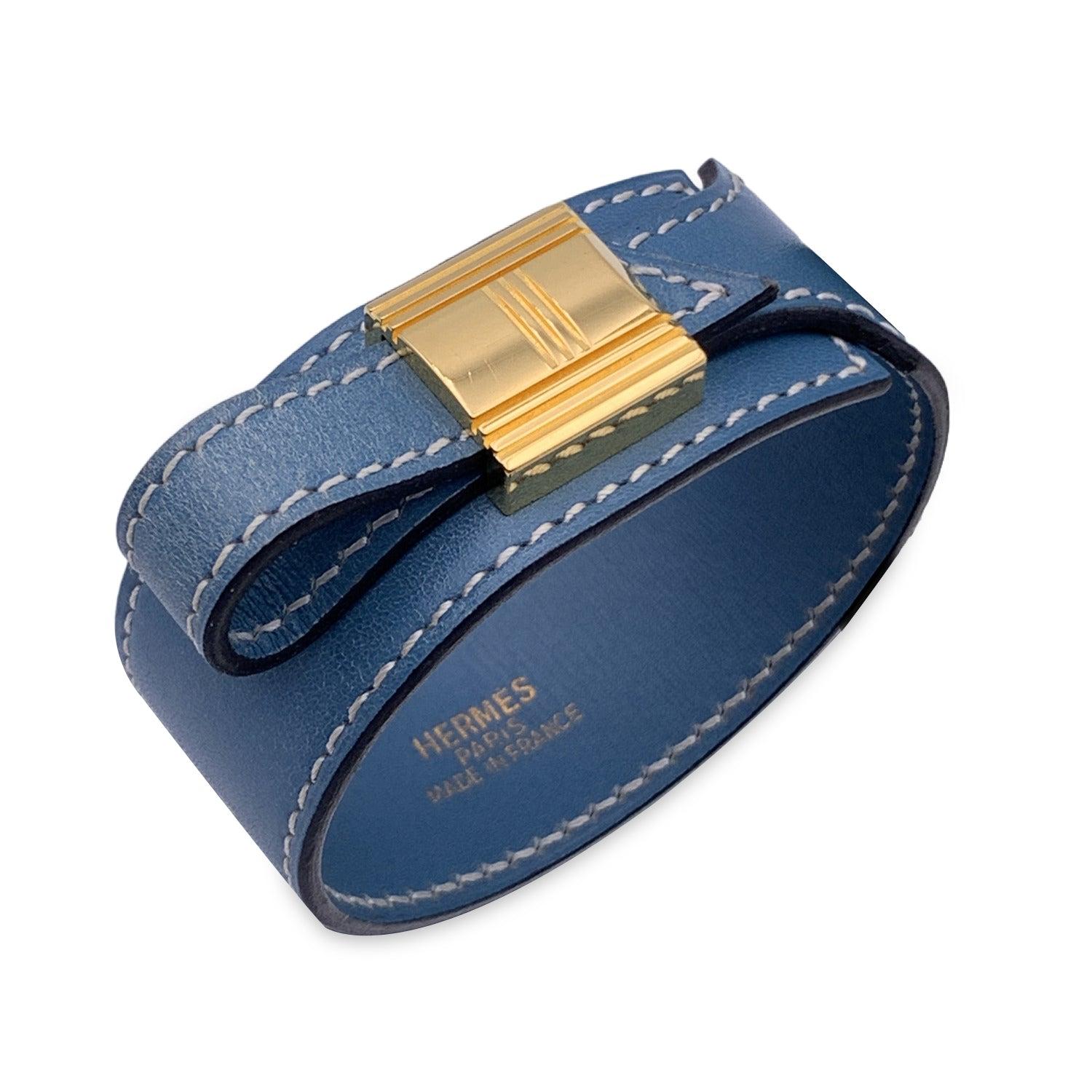 Vintage Hermes 'Artemis' leather bracelet in blue color. Gold buckle. For wrists up to 16 inches - 15.2 cm in circumference. 'Hermes Paris - made in France' embossed inside the bracelet. Blind stamp is a B encased in a Square (year of production