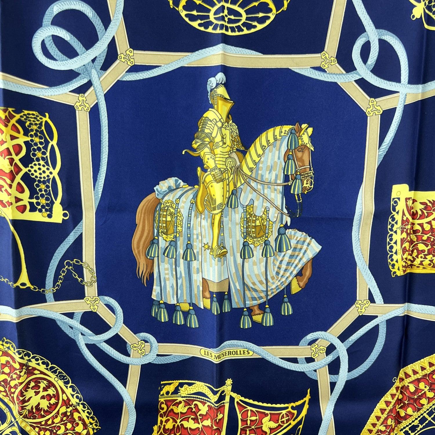 Step into the storied world of chivalry with this stunning Hermès silk scarf titled 'Les Muserolles', designed by Christiane Vauzelles and first issued in 1986. A tribute to equestrian history and medieval pageantry, the scarf features a knight in