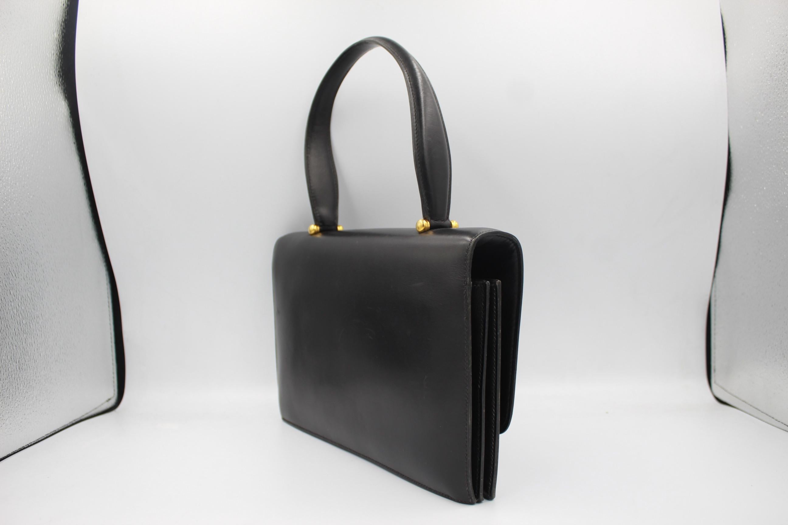 Vintage Hermes black leather bag in good vintage condition.
Size 26x16 cm 
Signed Inside, Clasp also signed, some signs of wear 
