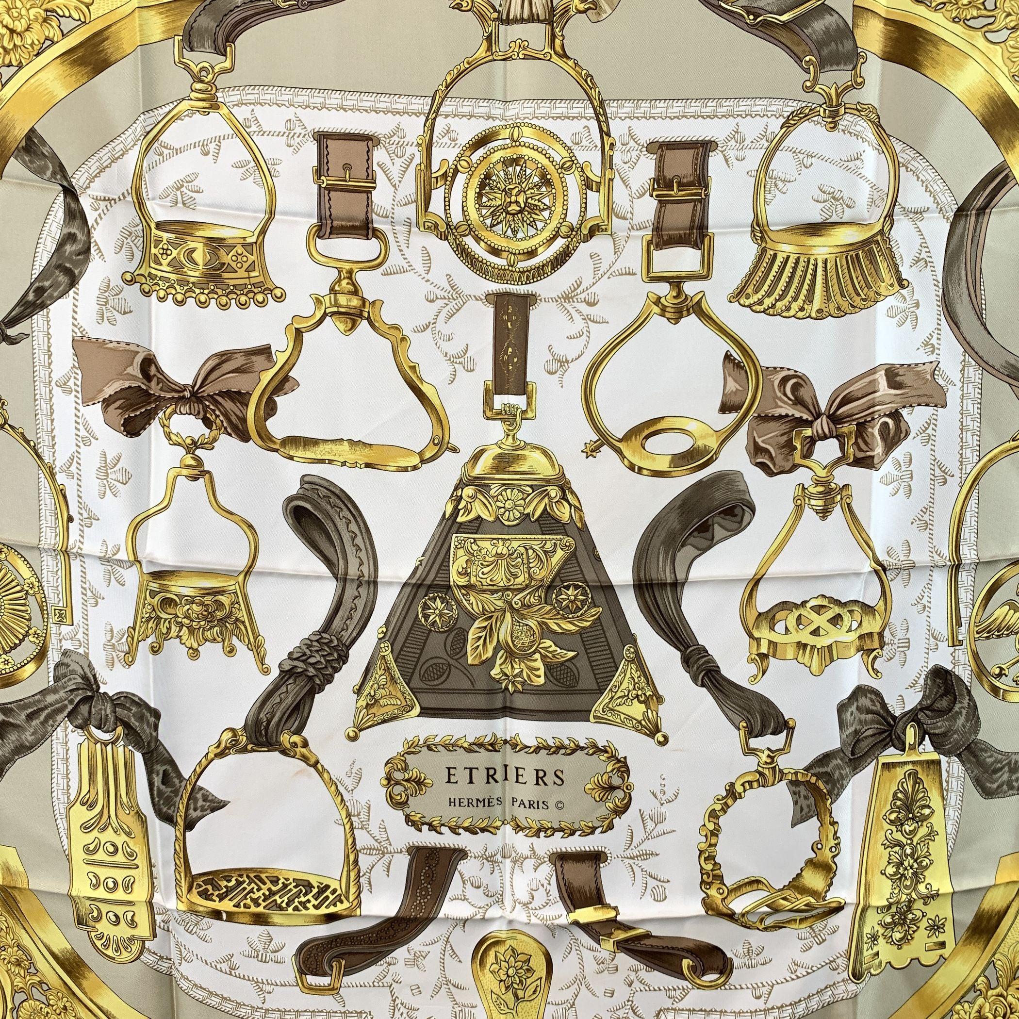 Step into the world of timeless elegance with the HERMÈS 'Etriers' Silk Scarf, designed by Françoise de la Perrière and first issued in 1964. This iconic piece has become a symbol of equestrian sophistication, featuring an intricate design of
