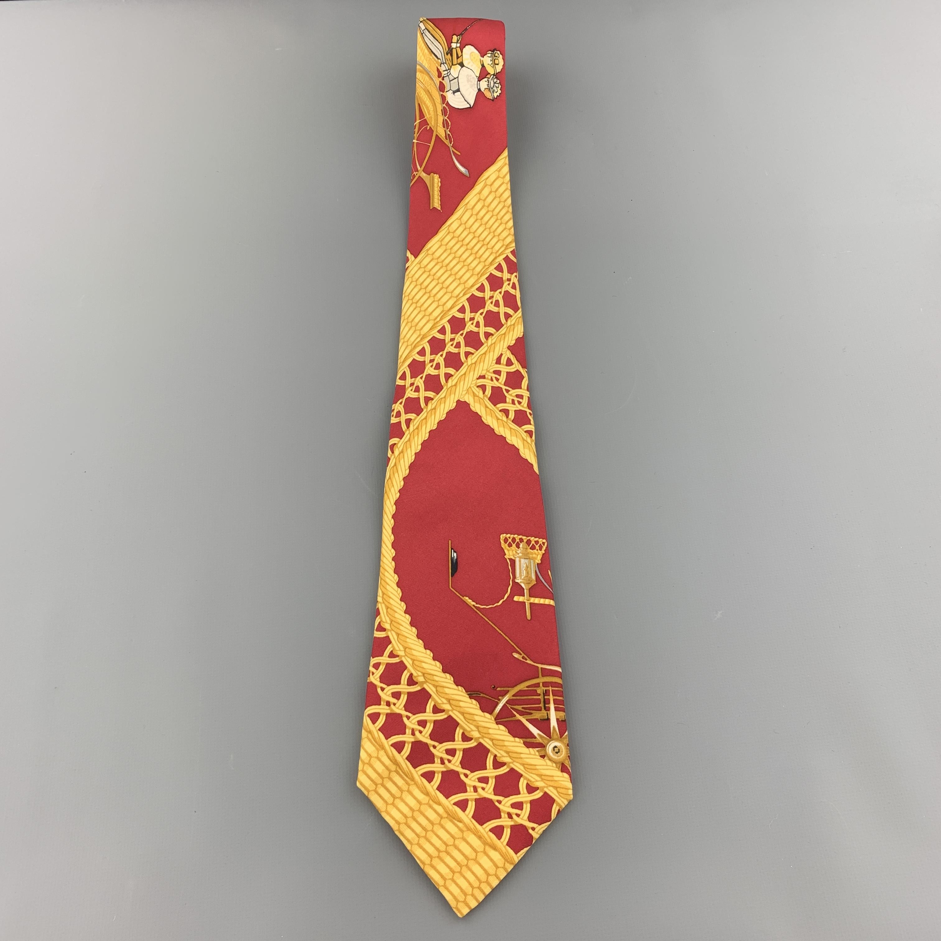 Vintage HERMES necktie comes in burgundy silk twill with all over large scale gold ornate print. Made in France.

Excellent Pre-Owned Condition.

Width: 3.5 in.