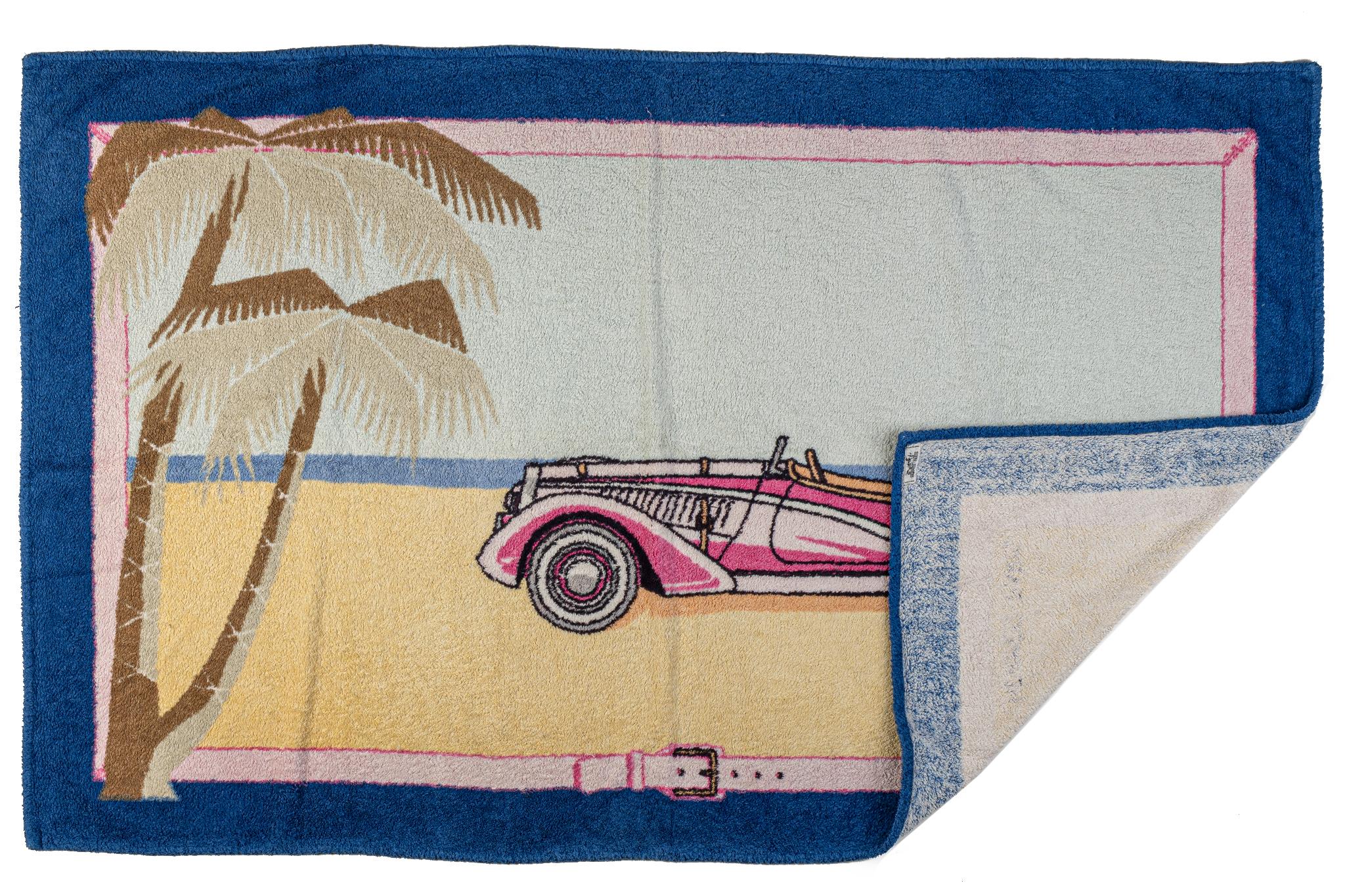 Blue, pink and beige cotton Hermès beach towel with car on the beach with palm tree design. 100% cotton.