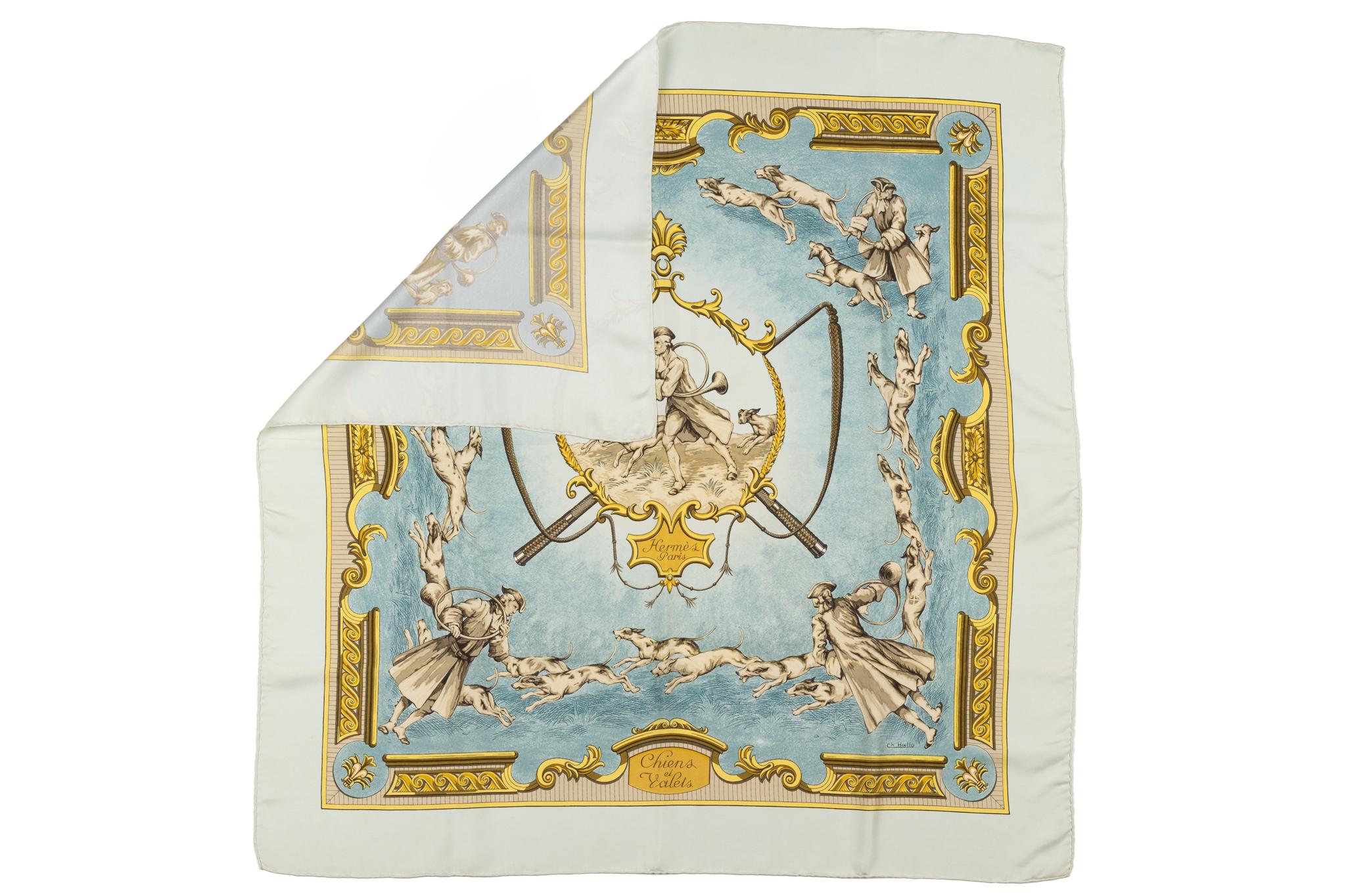 Hermès vintage celeste silk scarf with hunting dogs scene. Gold baroque trim design. Hand rolled edges. No label, no box.