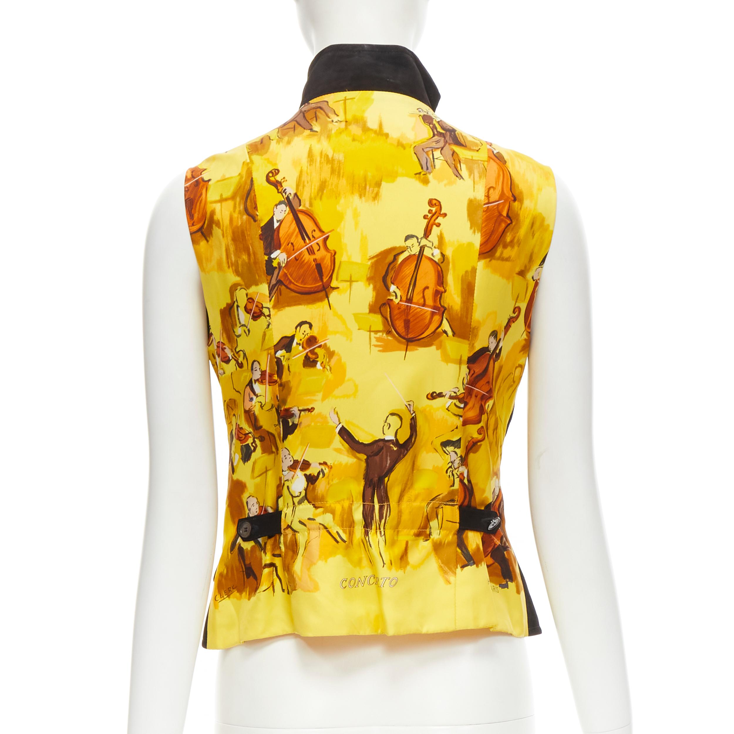 HERMES Vintage Concerto yellow Violinist silk black suede leather vest FR38 S 
Reference: GIYG/A00195 
Brand: Hermes 
Material: Suede 
Color: Black 
Pattern: Solid 
Closure: Zip 
Extra Detail: Concerto yellow violinist print silk back panel. Genuine