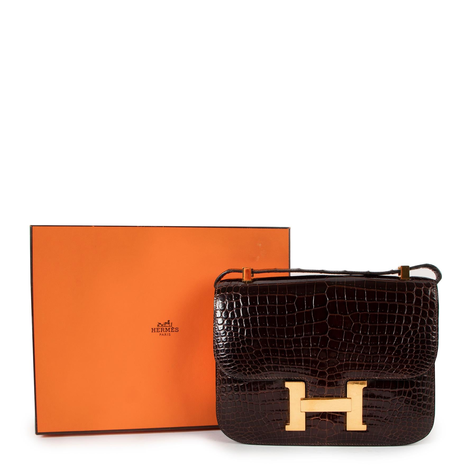 Hermès Vintage Constance 23 Brown Shiny Crocodile Porosus Gold Hardware

This Hermès Constance 23 in Crocodile Porosus is the epitome of luxury.

This vintage Constance is crafted from dark brown Crocodile Porosus skin. Known for its modern looking