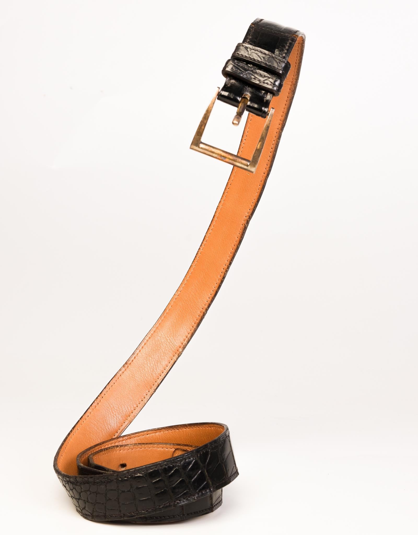 Black crocodile leather vintage Hermes belt with gold-tone buckle. 

COLOR: Black
MATERIAL: Leather
MEASURES: L 45